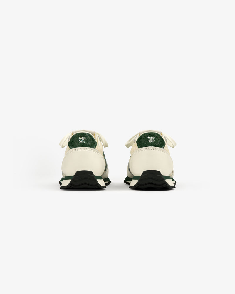 ALD / New Balance 471 sneakers in white and green, viewed from the back on a white background.