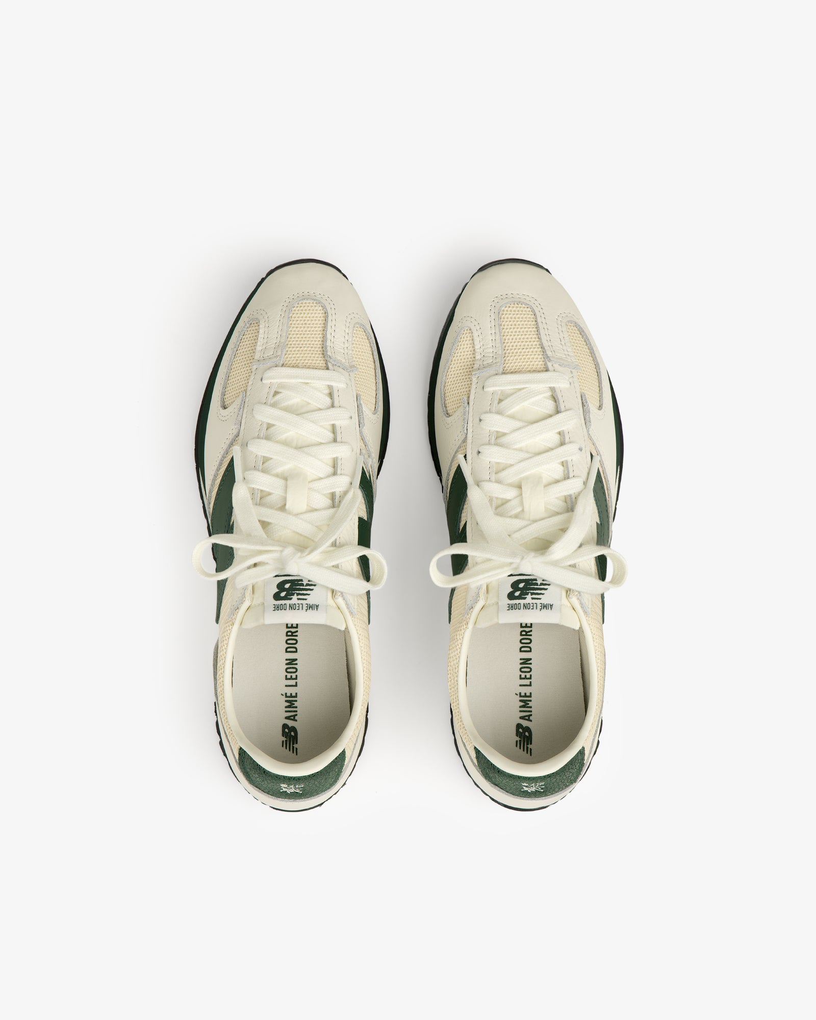 The ALD / New Balance 471 in cream and green, viewed from above on a white background.