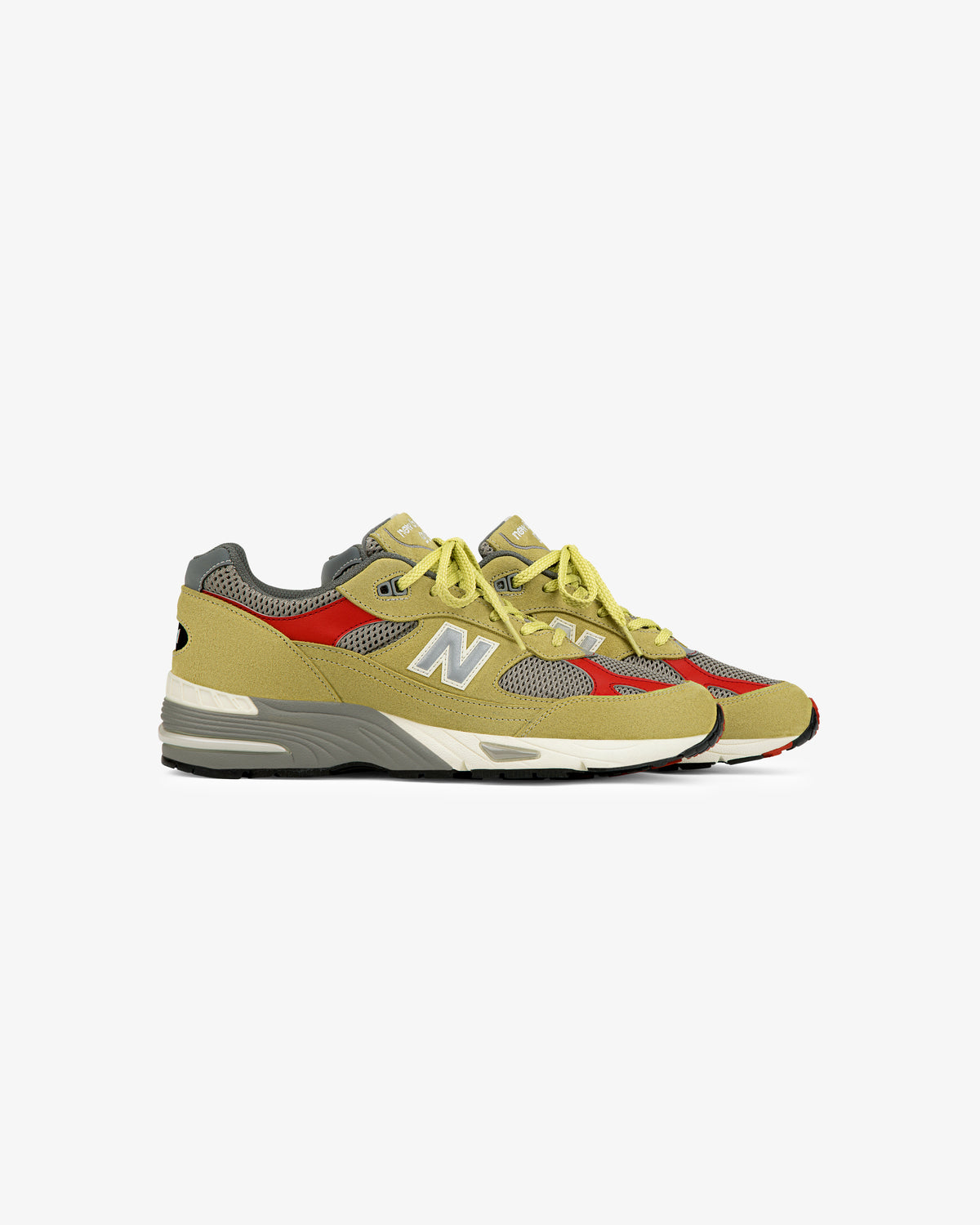 A pair of ALD / New Balance Made in UK 991 sneakers in yellow, red, and gray mesh and suede on a white background.