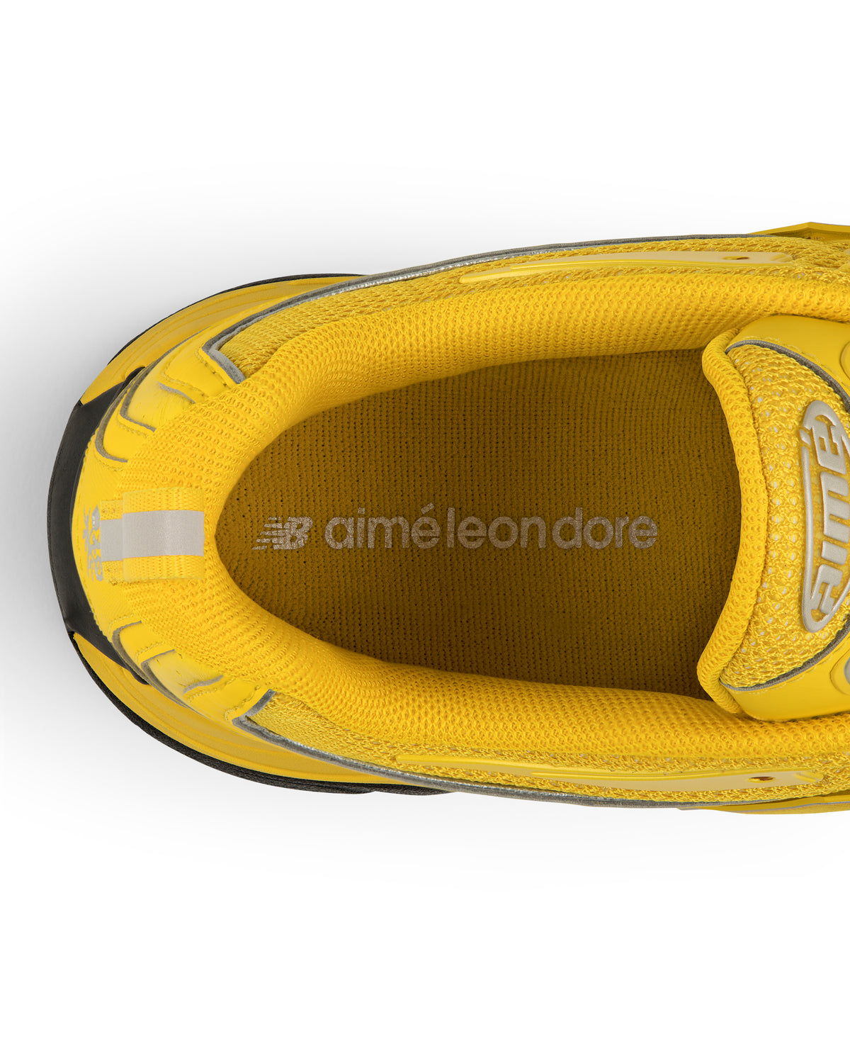 Top view of the yellow ALD / New Balance RC56 sneaker with aimé leon dore branding on the insole.