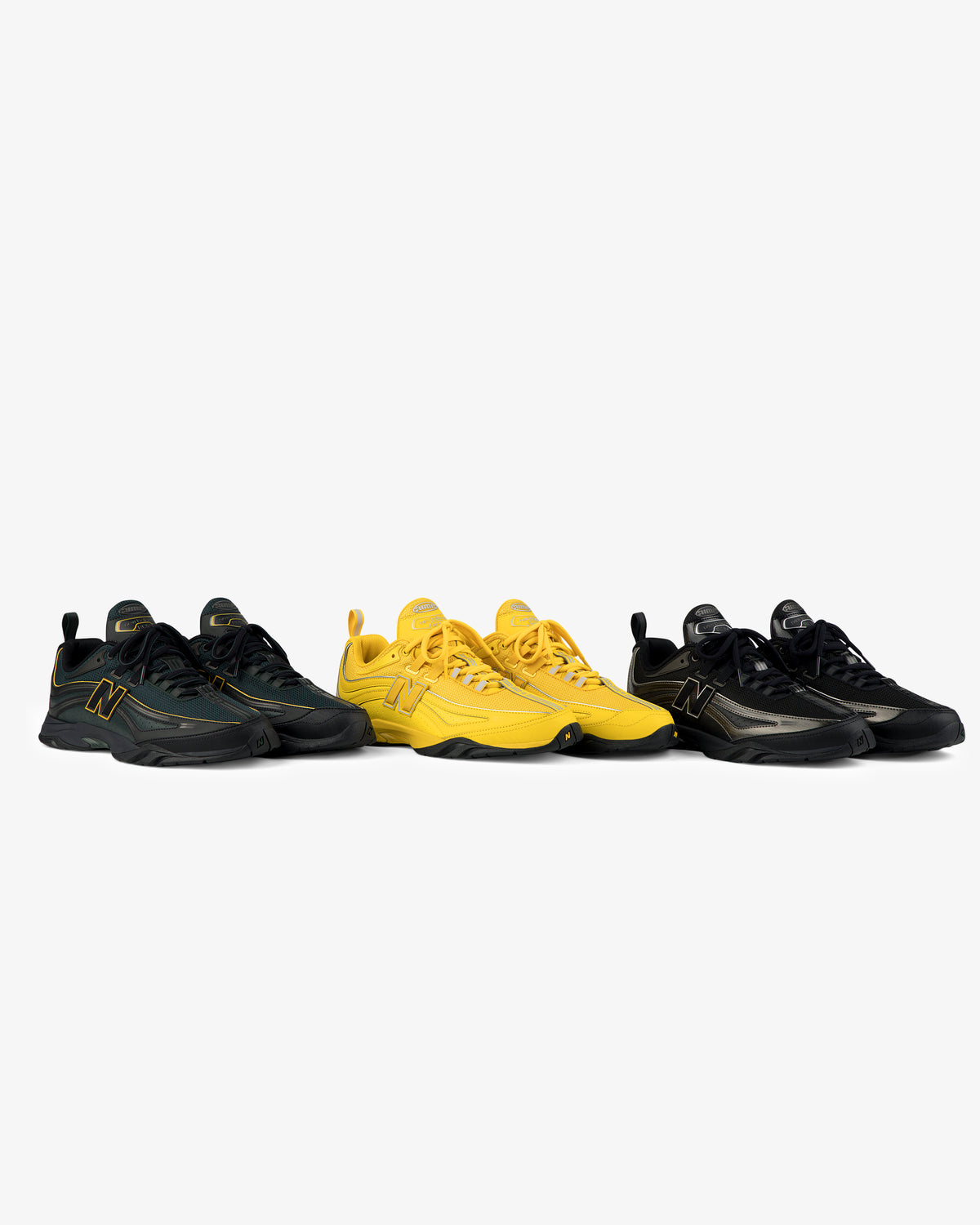 Three pairs of ALD / New Balance RC56 sneakers in black, yellow, and black with gold on a white background.