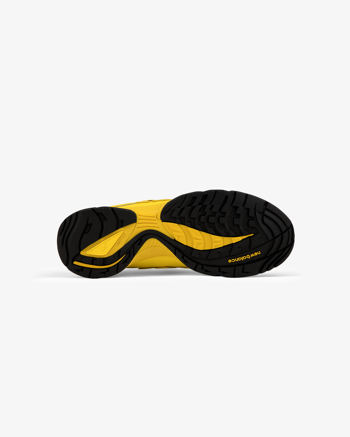 ALD / New Balance RC56 shoe sole in black and yellow with textured tread, bottom view on white background.