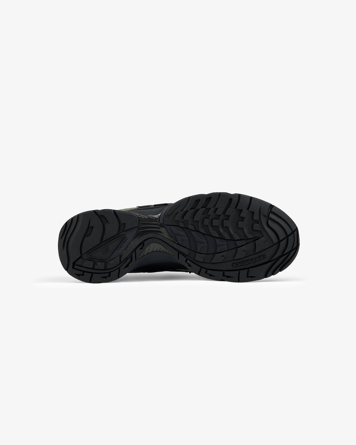 ALD / New Balance RC56 black rubber sneaker sole with textured grip, shown from the bottom on a white background.