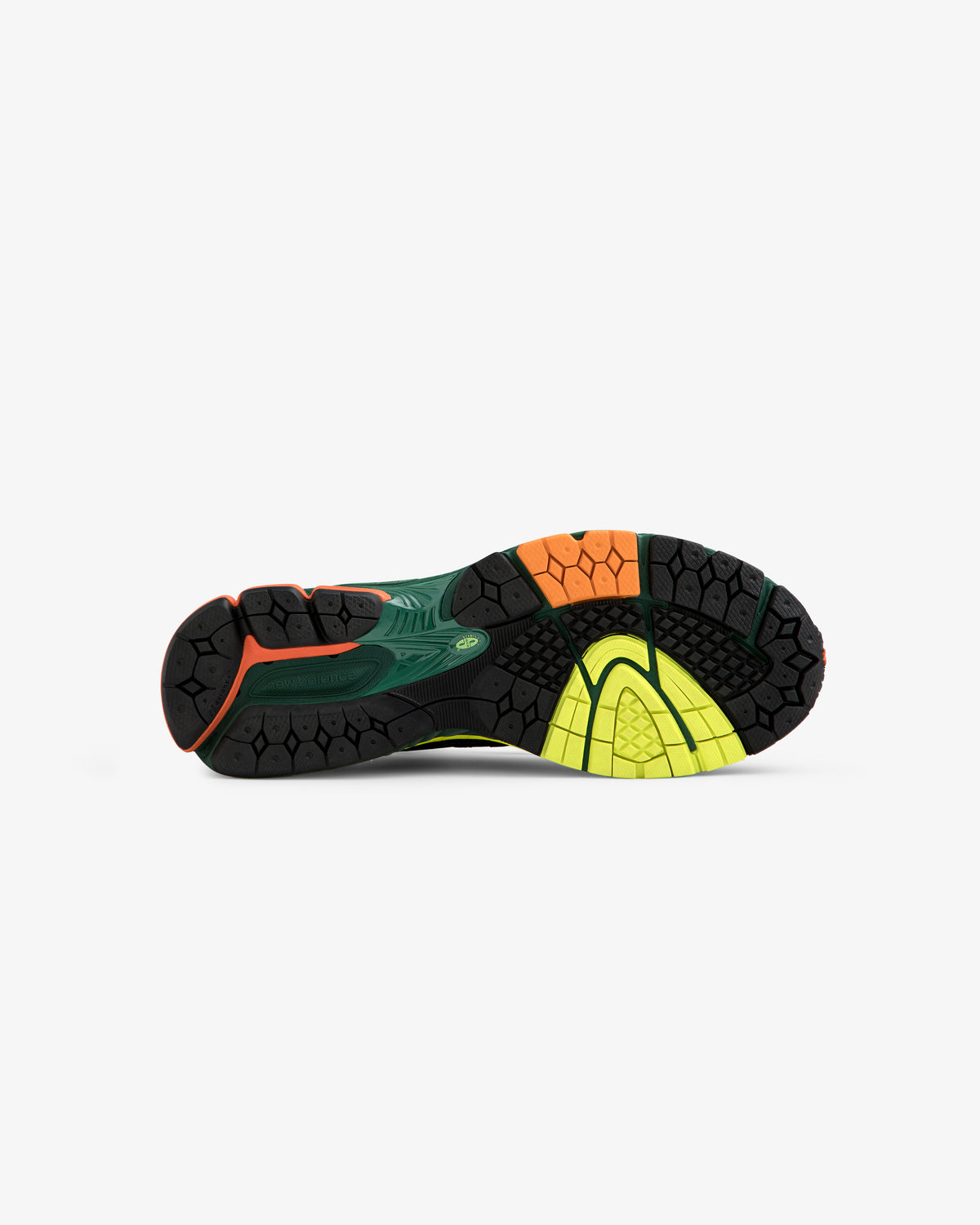 Sole of ALD / New Balance 860v2 running shoe featuring black, green, orange, and yellow tread on white background.