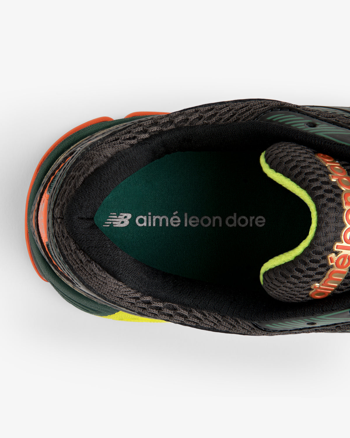 Top view of the ALD / New Balance 860v2 sneaker in dark colors with NB aimé leon dore branding on the insole.