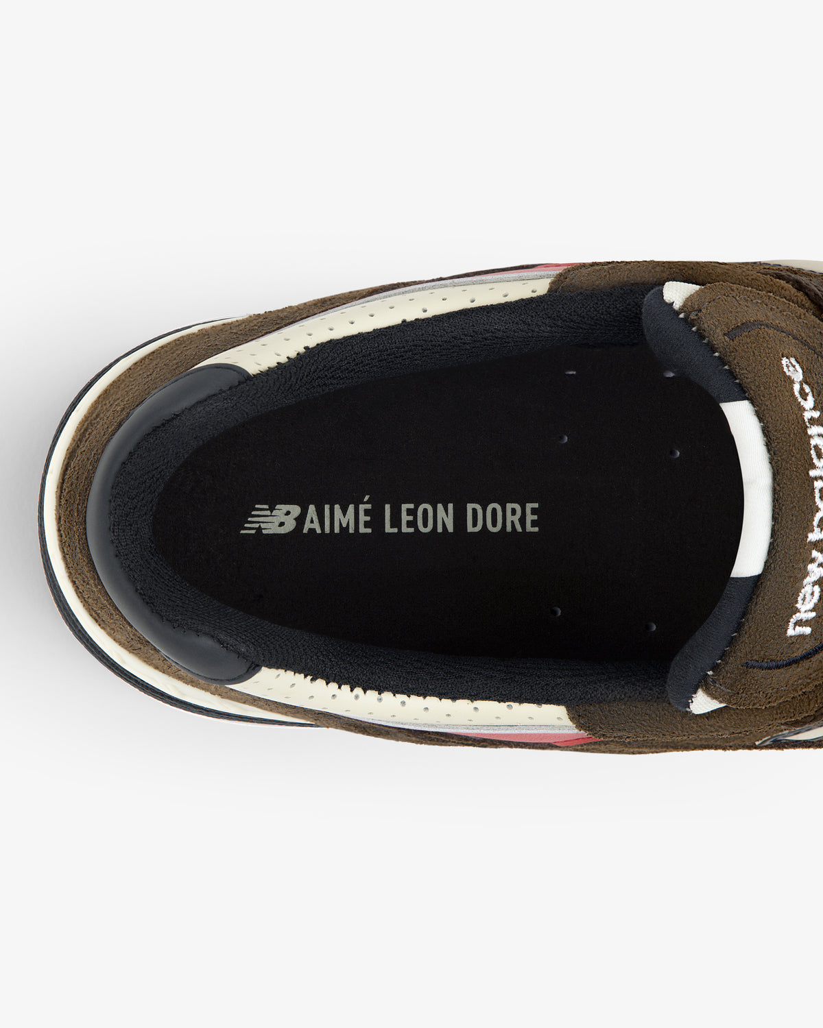 Top view of the ALD / New Balance Made in UK 991 sneaker insole with AIMÉ LEON DORE branding in white text.