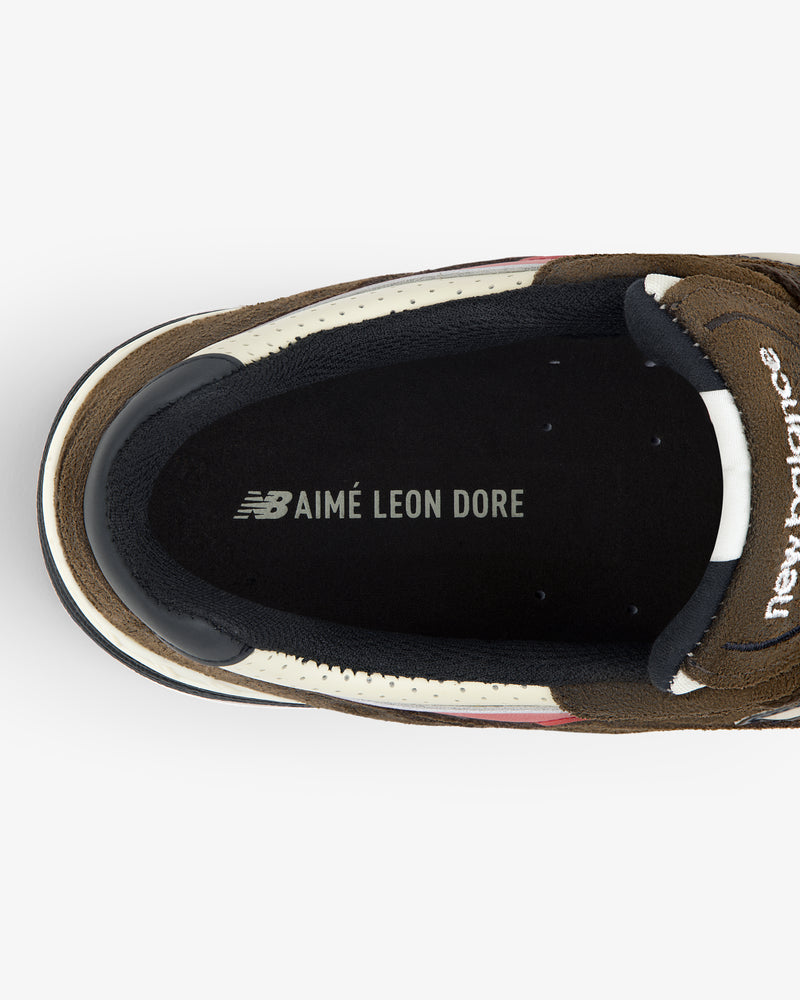 Top view of the ALD / New Balance Made in UK 991 sneaker insole with AIMÉ LEON DORE branding in white text.