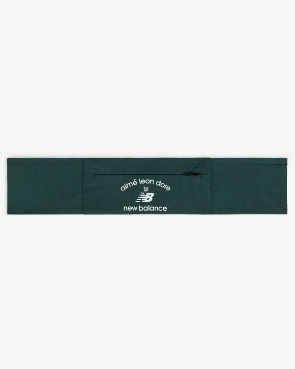 ALD / New Balance Performance Running Belt in dark green with white logos on the center zippered pocket.
