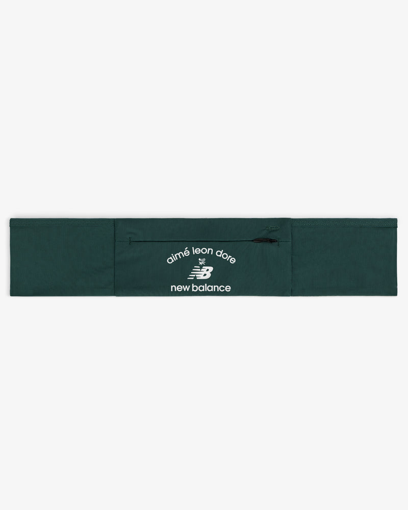 ALD / New Balance Performance Running Belt in dark green with white logos on the center zippered pocket.