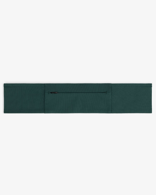 The ALD / New Balance Performance Running Belt in dark green with a center zip pocket is shown laid flat on white.