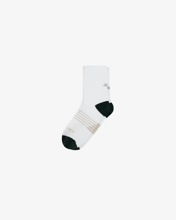 ALD / New Balance Running Crew Sock in white with dark green toe/heel, beige stripes, on plain white background.