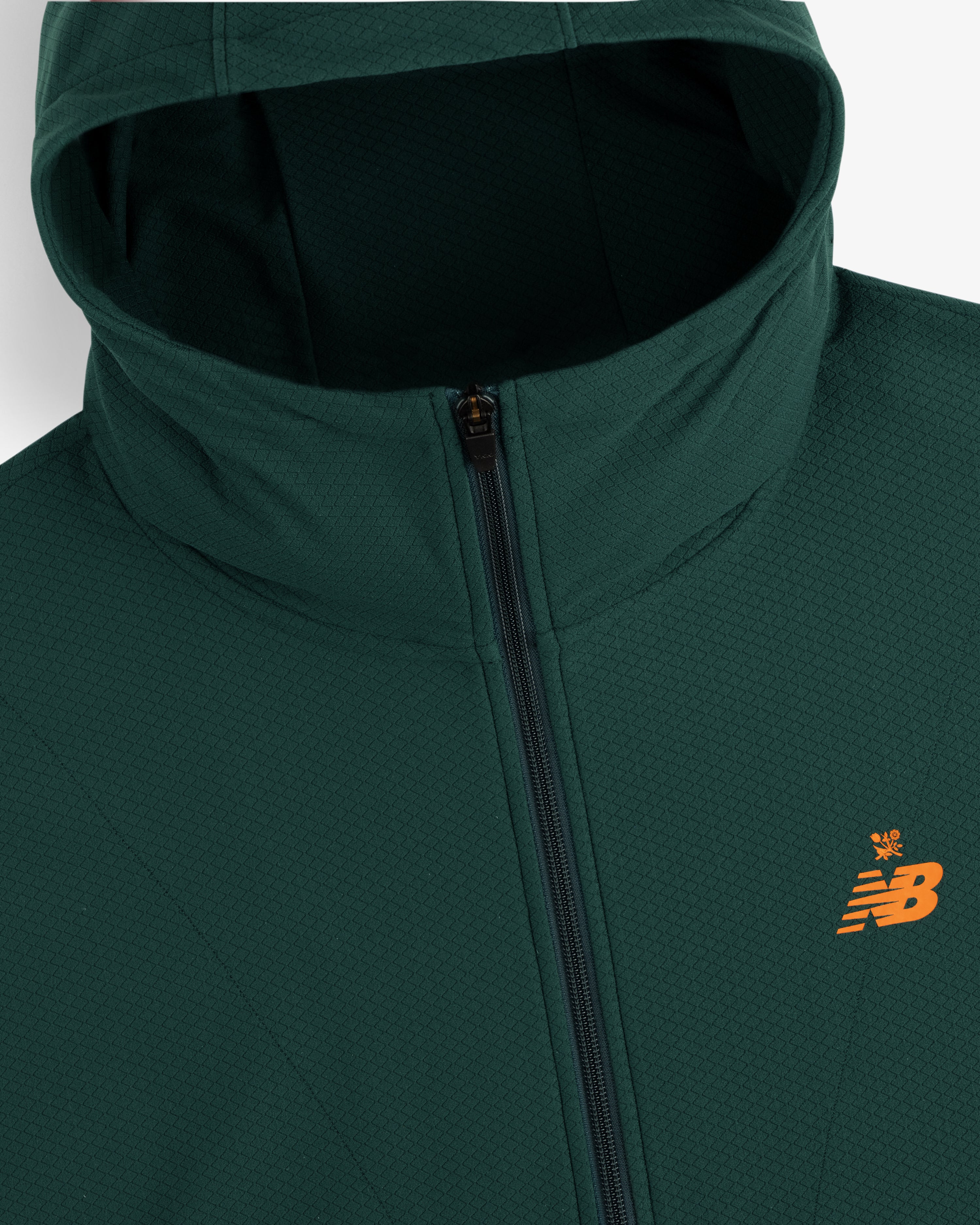 Dark green ALD / New Balance Full-Zip Warmup Hoodie with an orange logo, shown from the shoulders up.