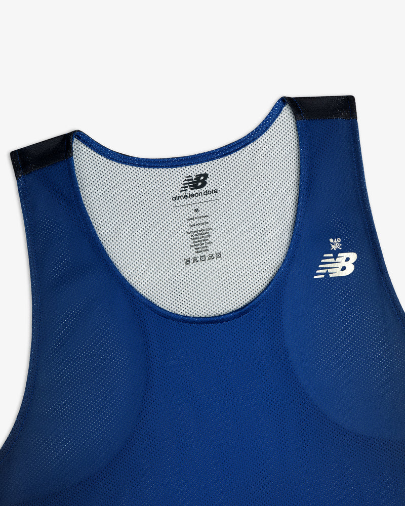 Blue ALD/New Balance Running Gradient Singlet with white logo and black shoulder accents, upper front view.
