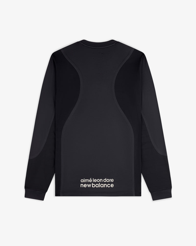 ALD / New Balance Performance Long-Sleeve Tee in black with curved seams and logo text at the lower back.