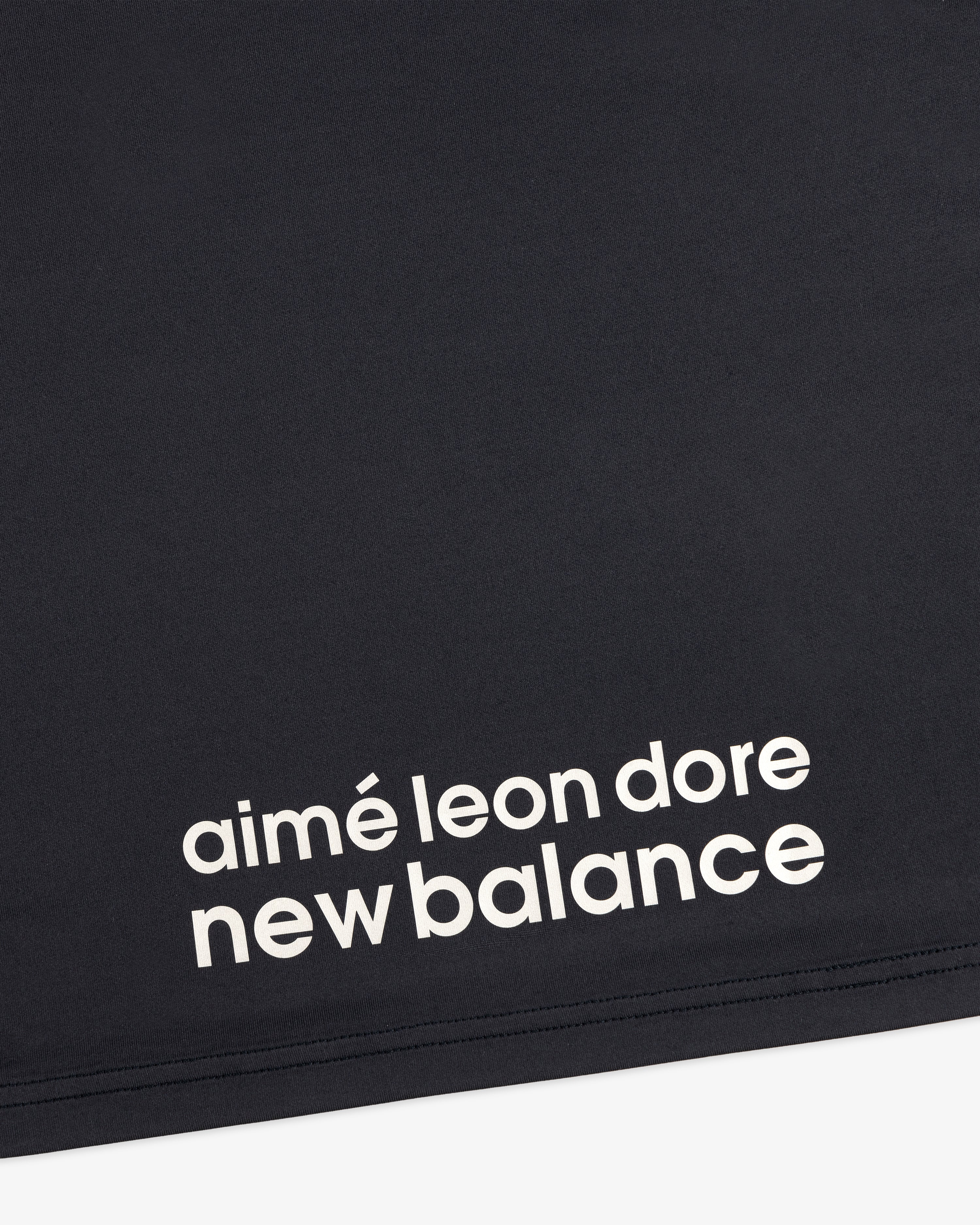 Black ALD / New Balance Performance Long-Sleeve Tee with white lowercase text in a modern font.