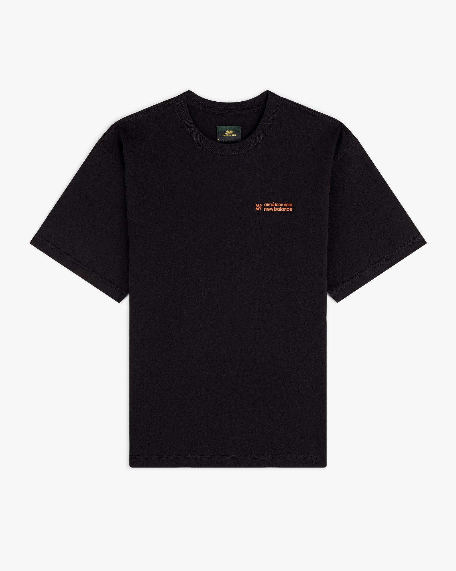 ALD / New Balance Running Bib Tee, black with small orange chest text, laid flat on a white background.