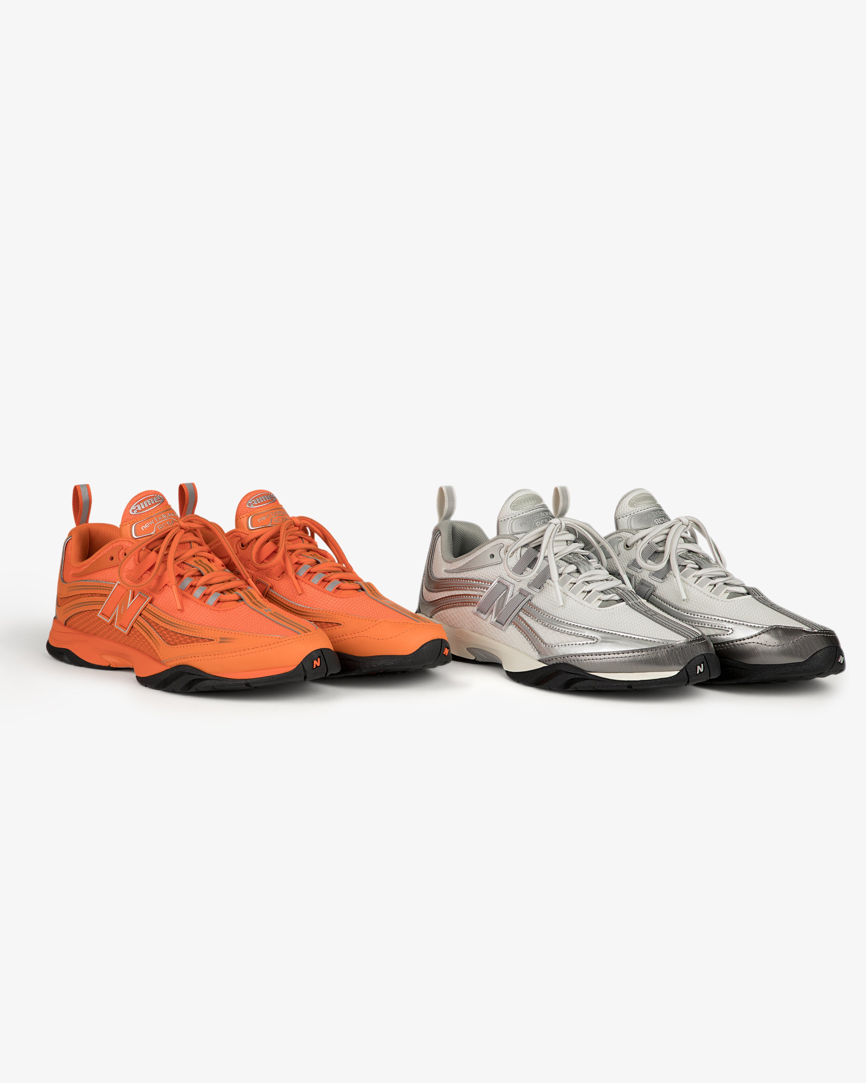 ALD / New Balance RC56 sneakers in orange and silver side by side on a white background.