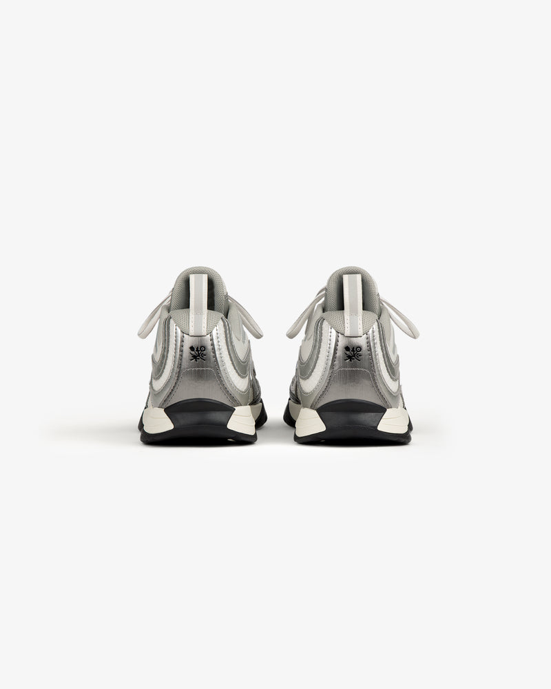ALD / New Balance RC56 sneakers in gray and white with FuelCell midsole, shown from the back.