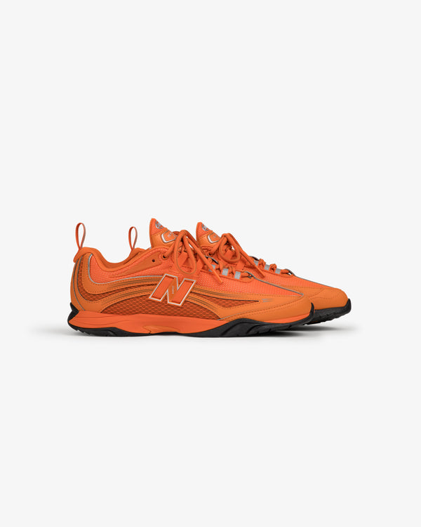 Bright orange ALD / New Balance RC56 sneakers with black soles and a large N logo.