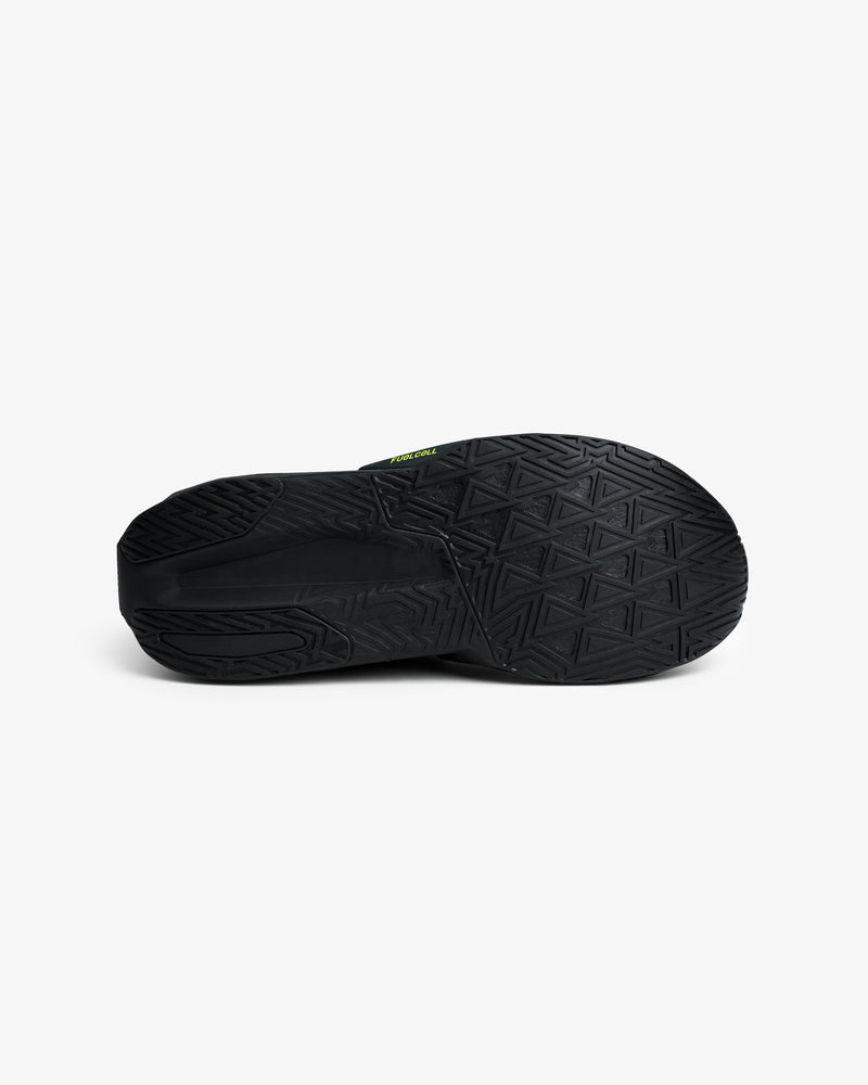 ALD / New Balance FuelCell Rebel v5 black rubber sole with geometric tread, shown from below on a white background.