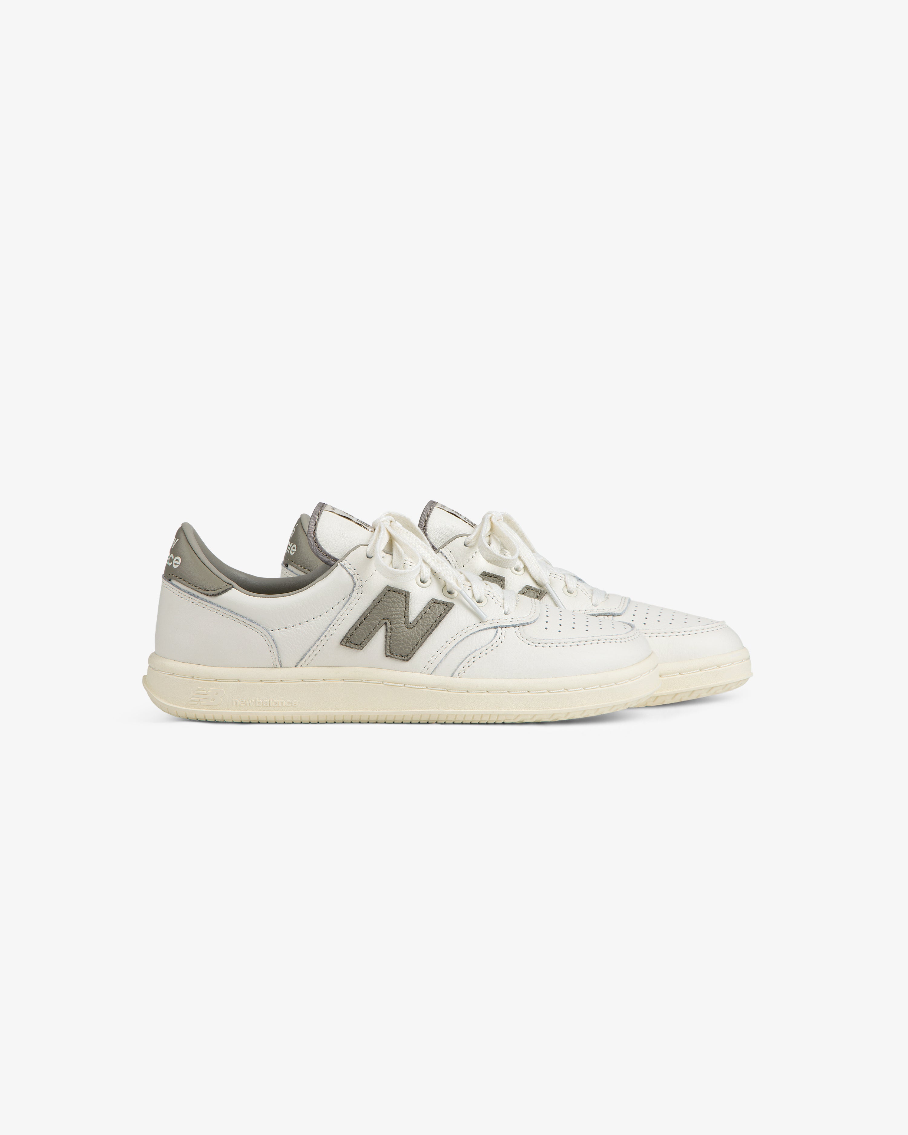 White leather ALD / New Balance T500 Tennis Oxfords with a grey logo and heel tab.