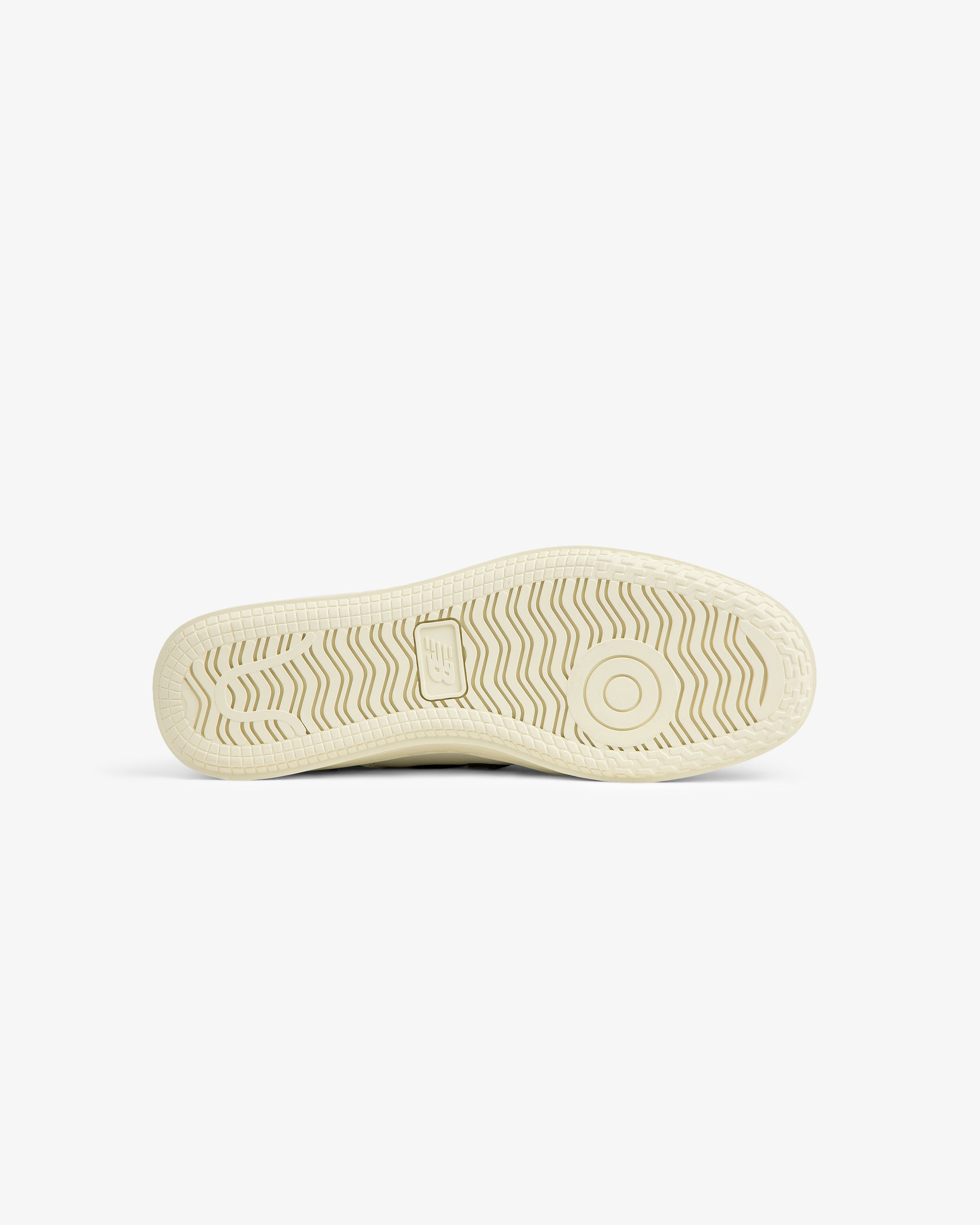 Off-white ALD / New Balance T500 Tennis Oxfords sole with a textured tread pattern and a central logo.