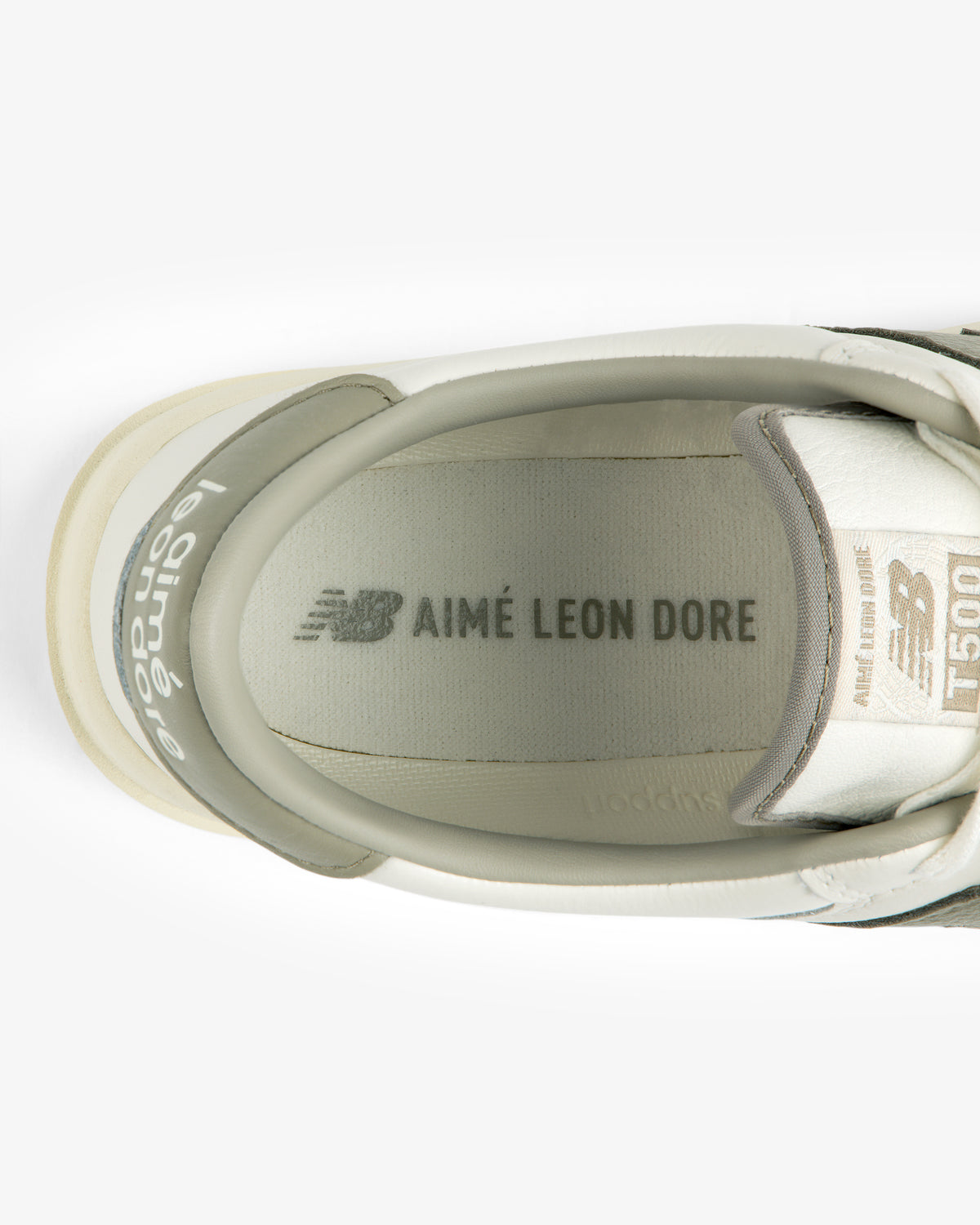 Top-down view of an ALD / New Balance T500 Tennis Oxfords interior showing the branded insole and tongue.