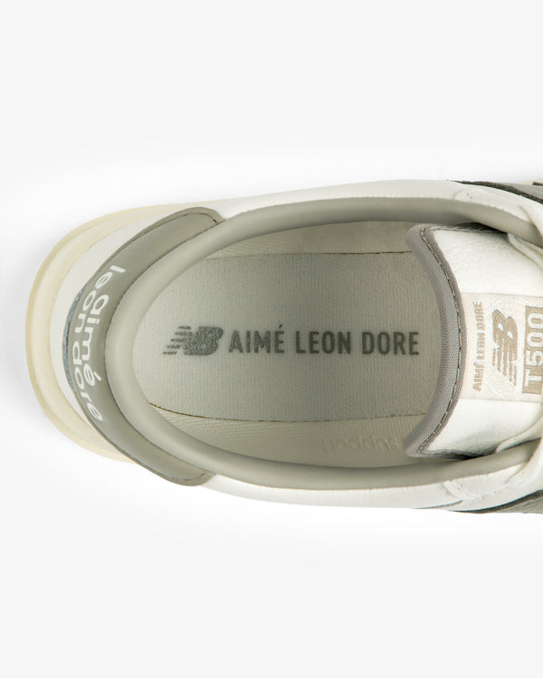 Top-down view of an ALD / New Balance T500 Tennis Oxfords interior showing the branded insole and tongue.