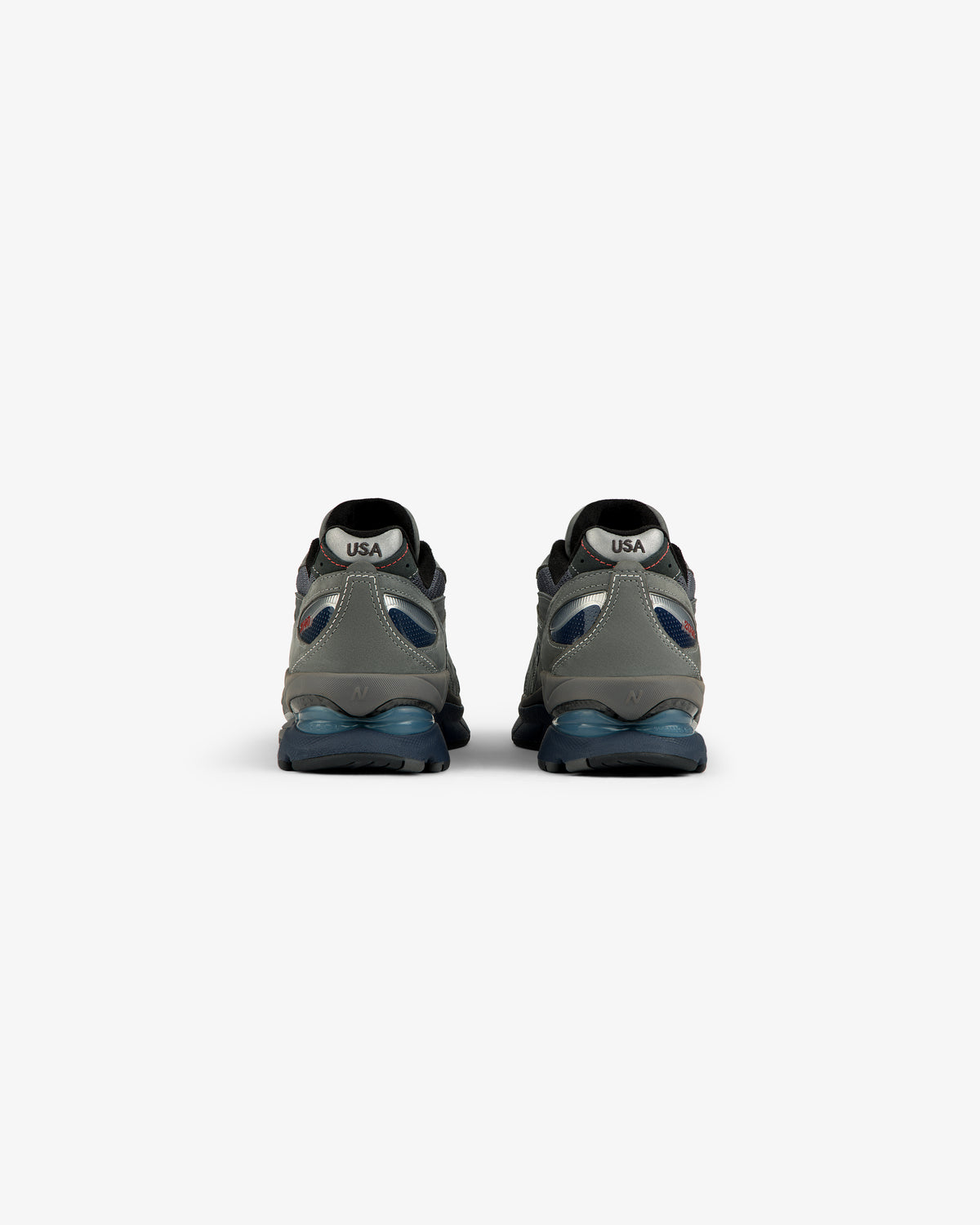 New Balance Made in USA 2040v5 sneakers, gray/blue, rear view with “USA” on white heel patches.