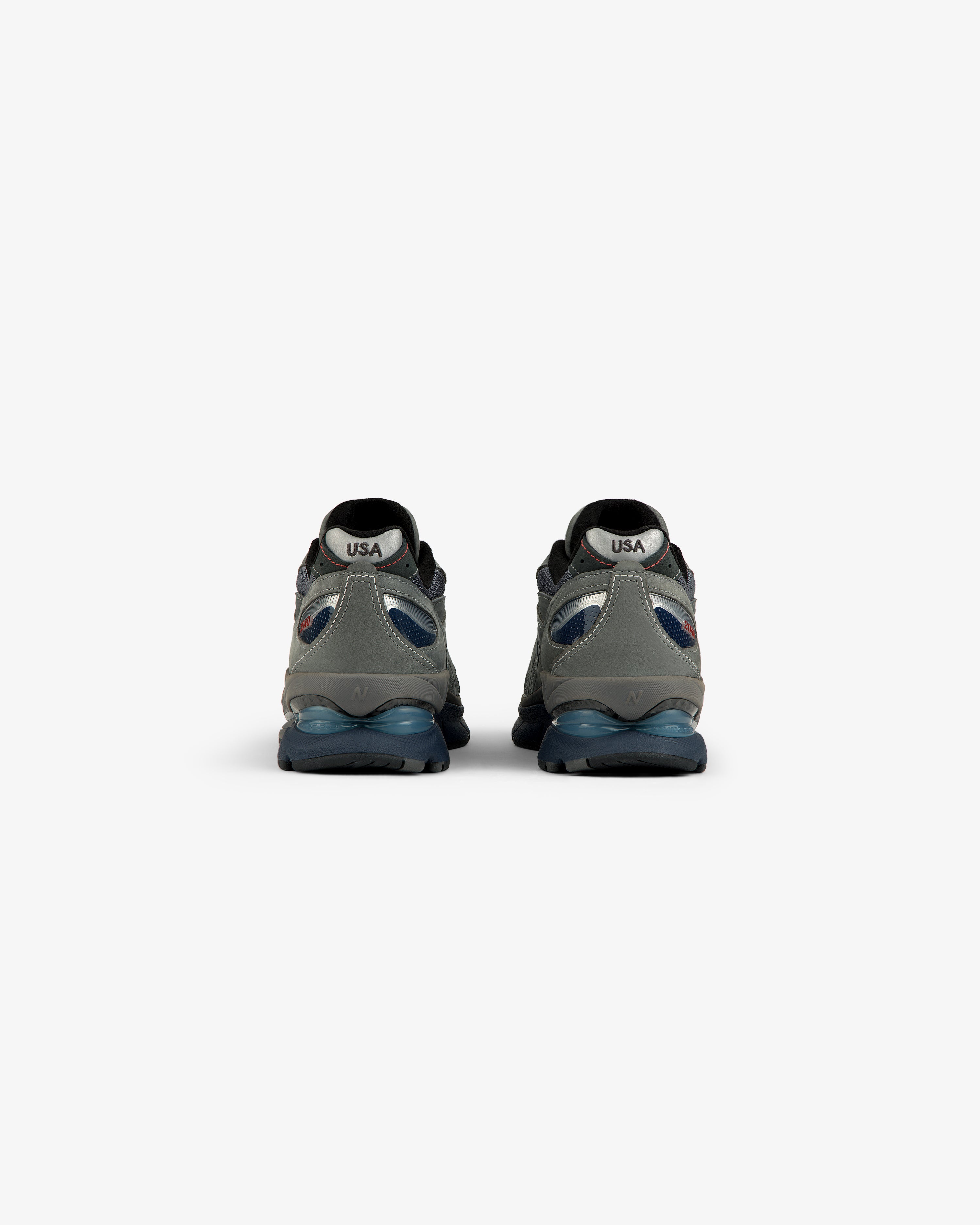 New Balance Made in USA 2040v5 sneakers, gray/blue, rear view with “USA” on white heel patches.