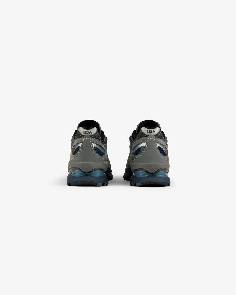 New Balance Made in USA 2040v5 sneakers, gray/blue, rear view with “USA” on white heel patches.