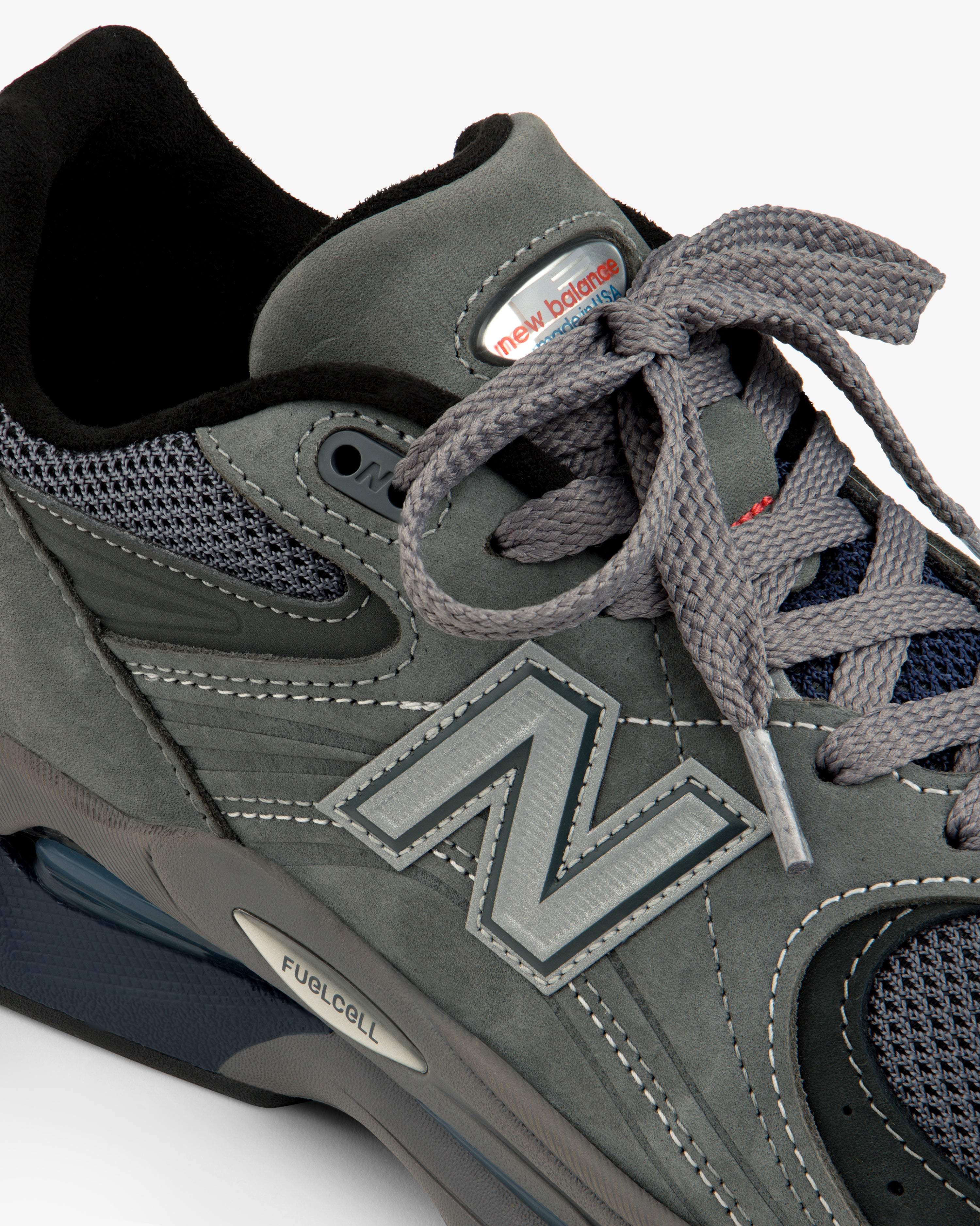 Close-up of the gray New Balance Made in USA 2040v5 sneaker with gray laces and mesh detailing.