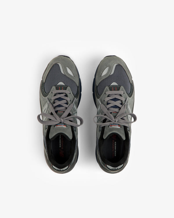 A pair of gray New Balance Made in USA 2040v5 sneakers shown from above on a white background.