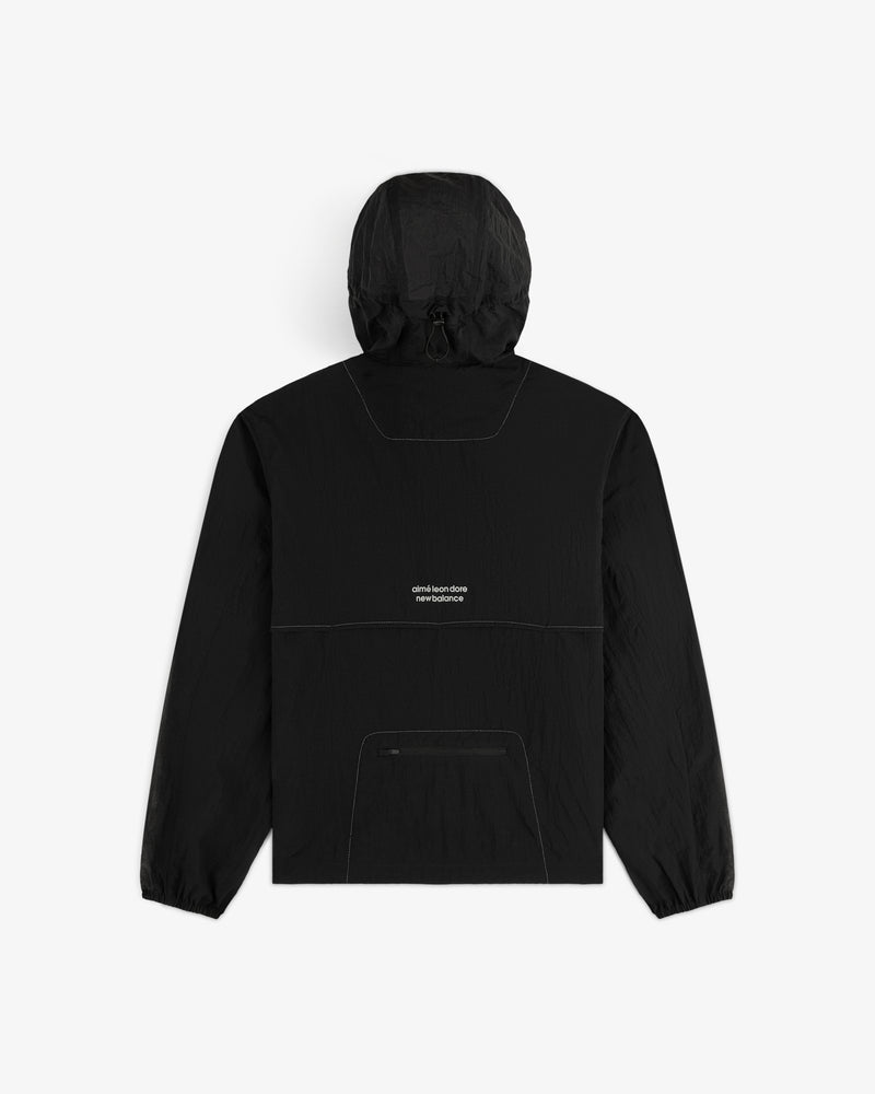 The ALD / New Balance Breathable Half-Zip Pullover is black with a front pocket and small white text on the back.