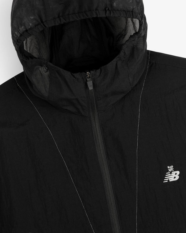 Black ALD / New Balance breathable half-zip pullover with hood and white logo on the left chest.