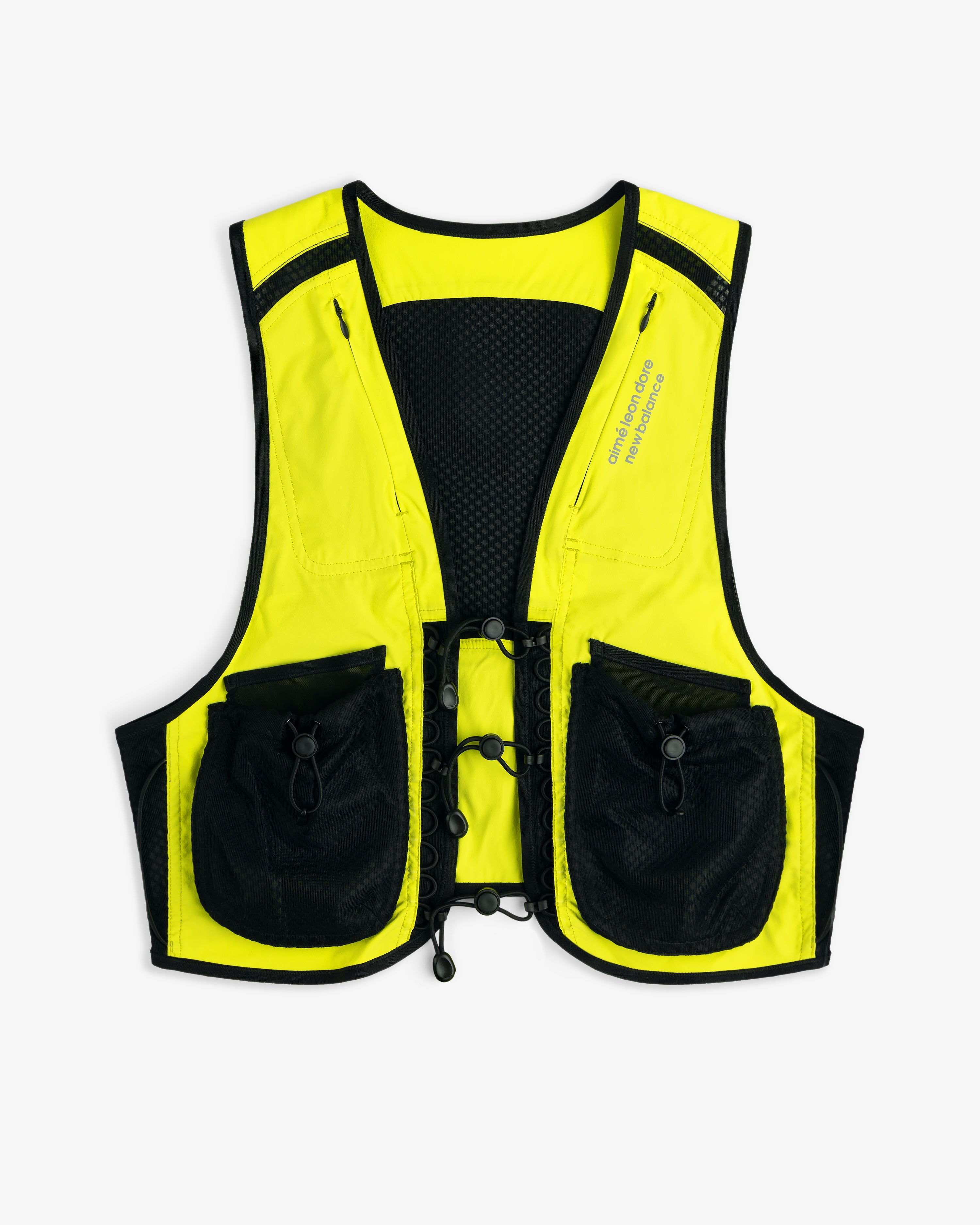 The ALD / New Balance Hydrovest is neon yellow with black trim and two large front pockets, shown on a white background.