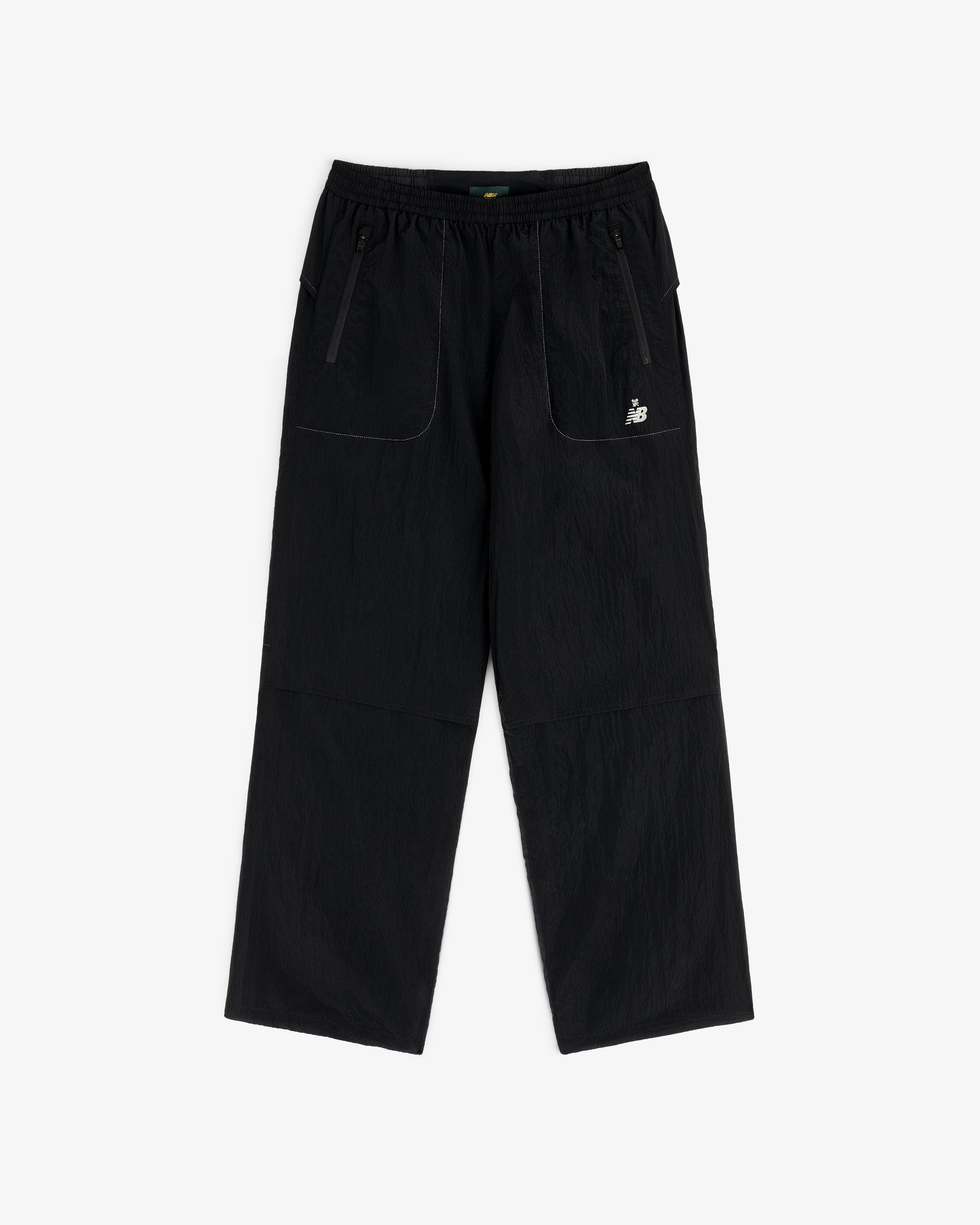 ALD / New Balance Lightweight Nylon Warmup Pant: black, straight-leg, elastic waist, front pockets, white logo.