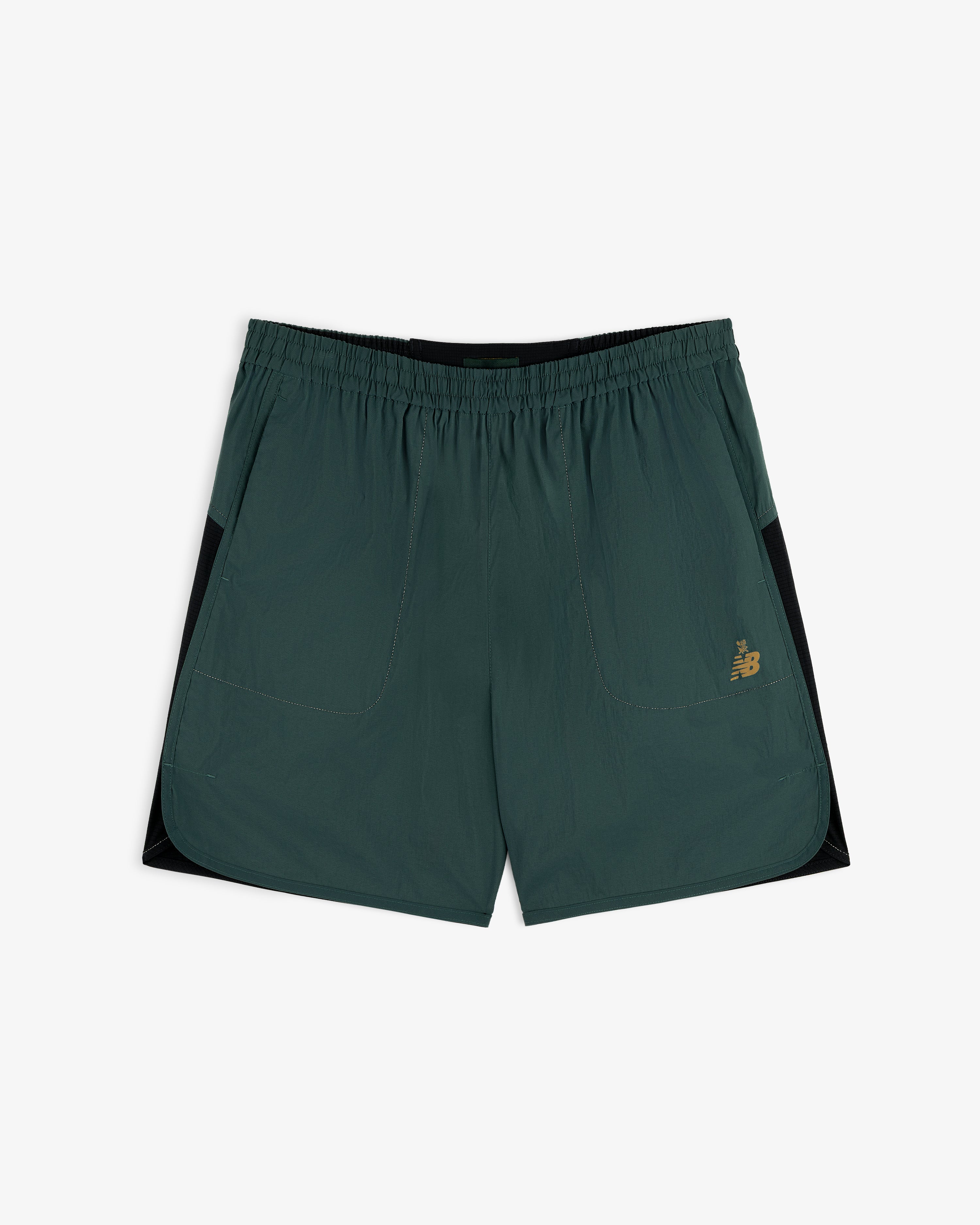 ALD / New Balance Performance Lightweight Running Short in dark green with black panels, pockets, and yellow logo.