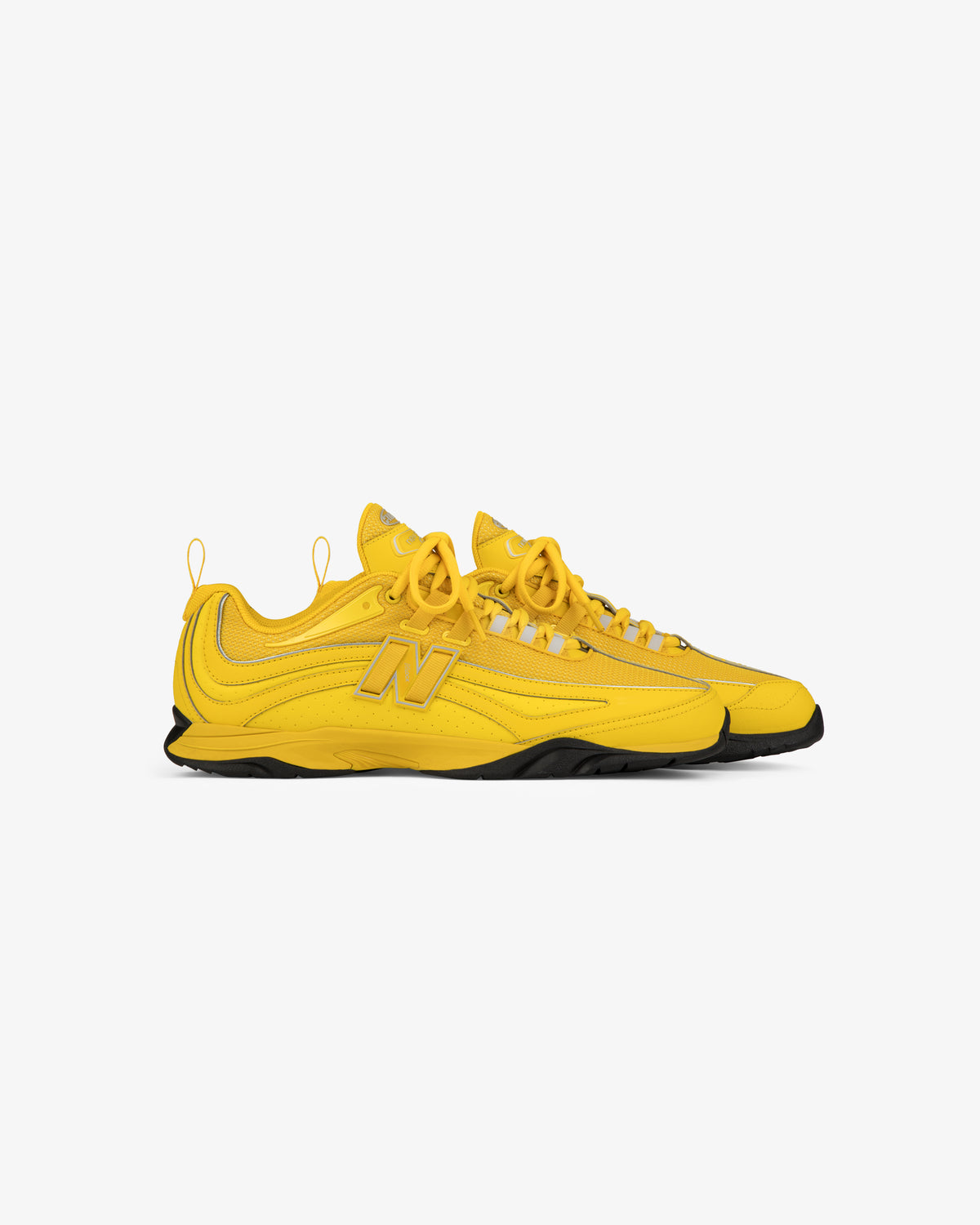 ALD / New Balance RC56 bright yellow sneakers with black soles and N logo, shown on a white background.