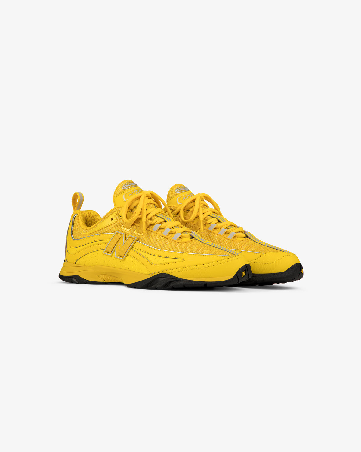 Bright yellow ALD / New Balance RC56 sneakers with black soles, laces, and a large N logo on the side.