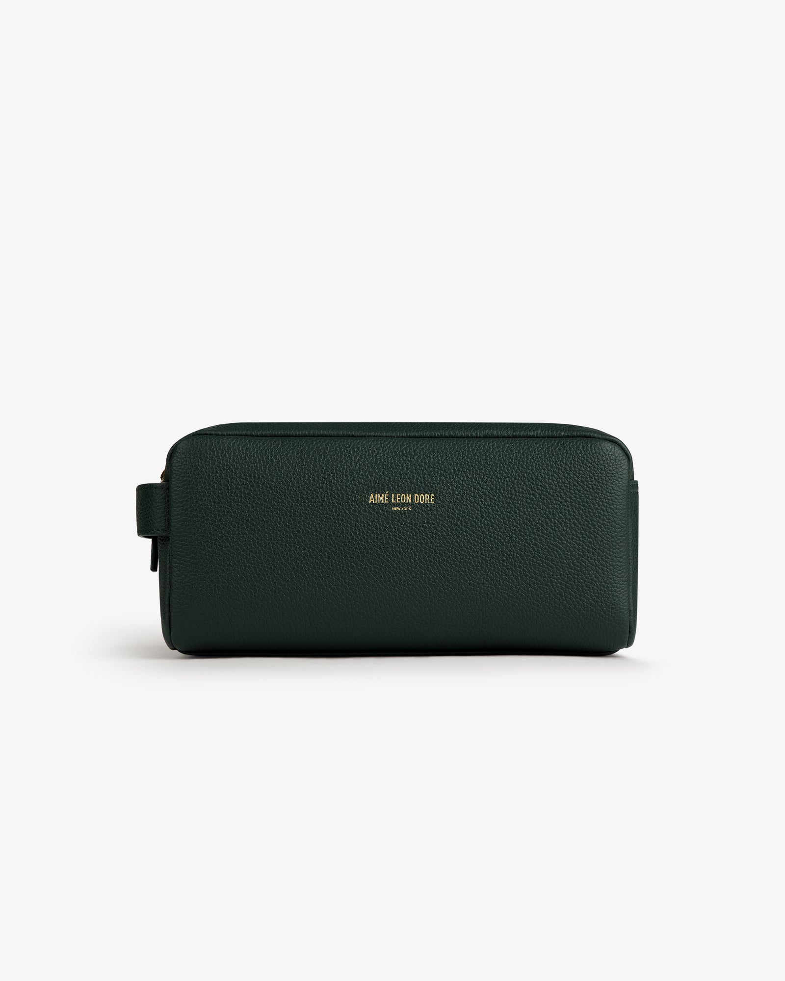 Dark green Leather Traveler Kit with gold AIME LEON DORE logo on front, shown against a white background.