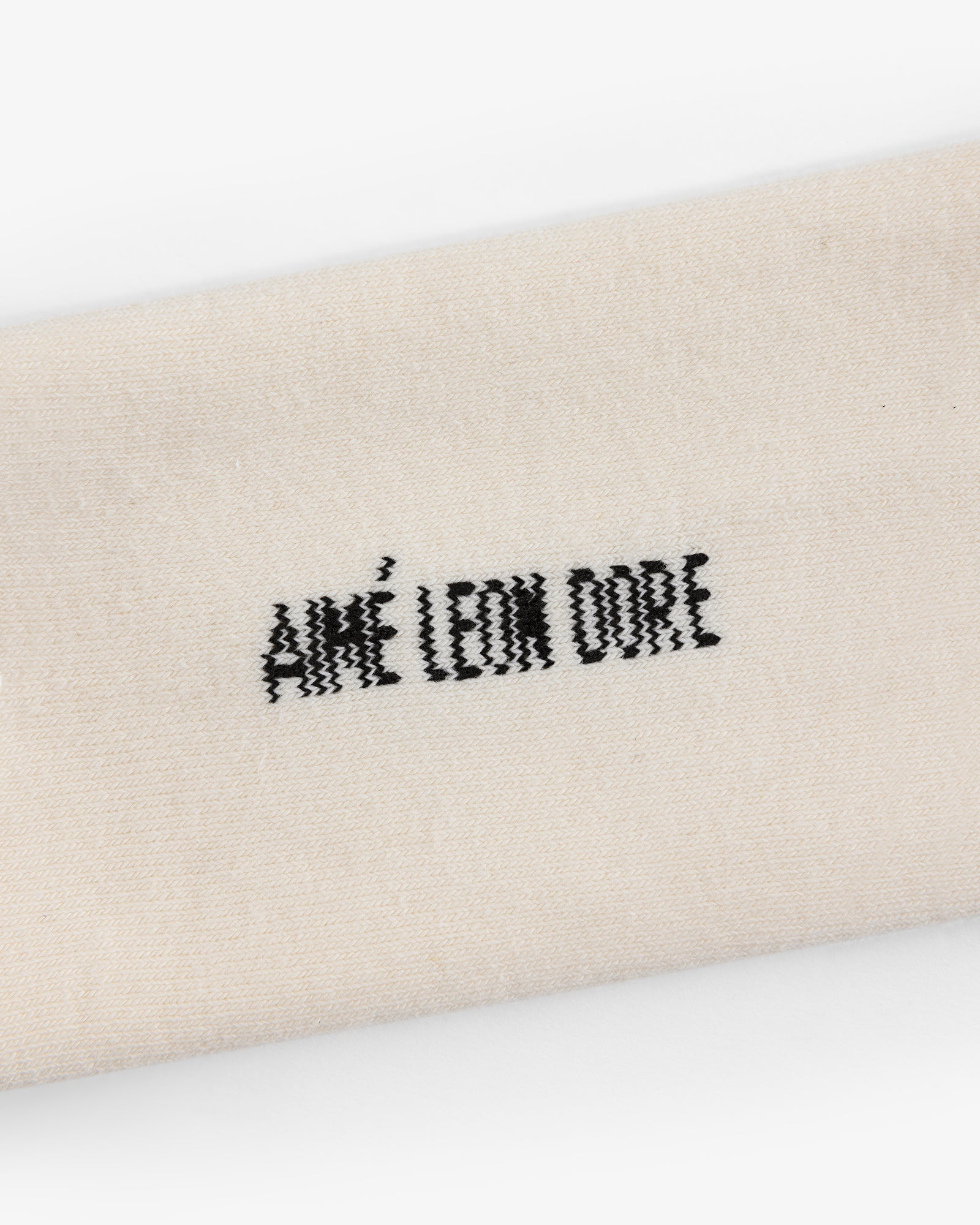 Beige Crew Sock 3-Pack with "AIMÉ LEON DORE" embroidered in black at the center.
