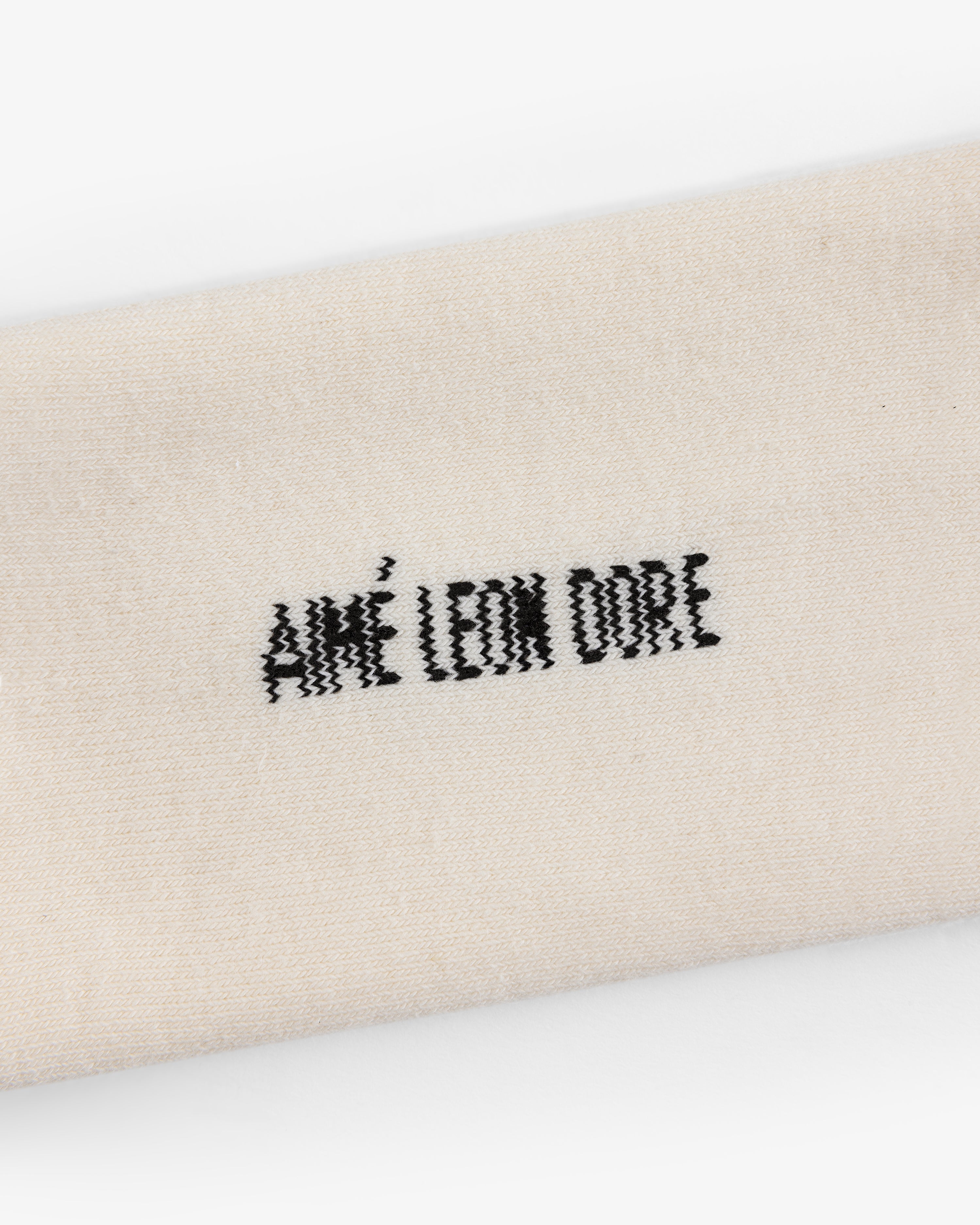 Beige Crew Sock 3-Pack with "AIMÉ LEON DORE" embroidered in black at the center.