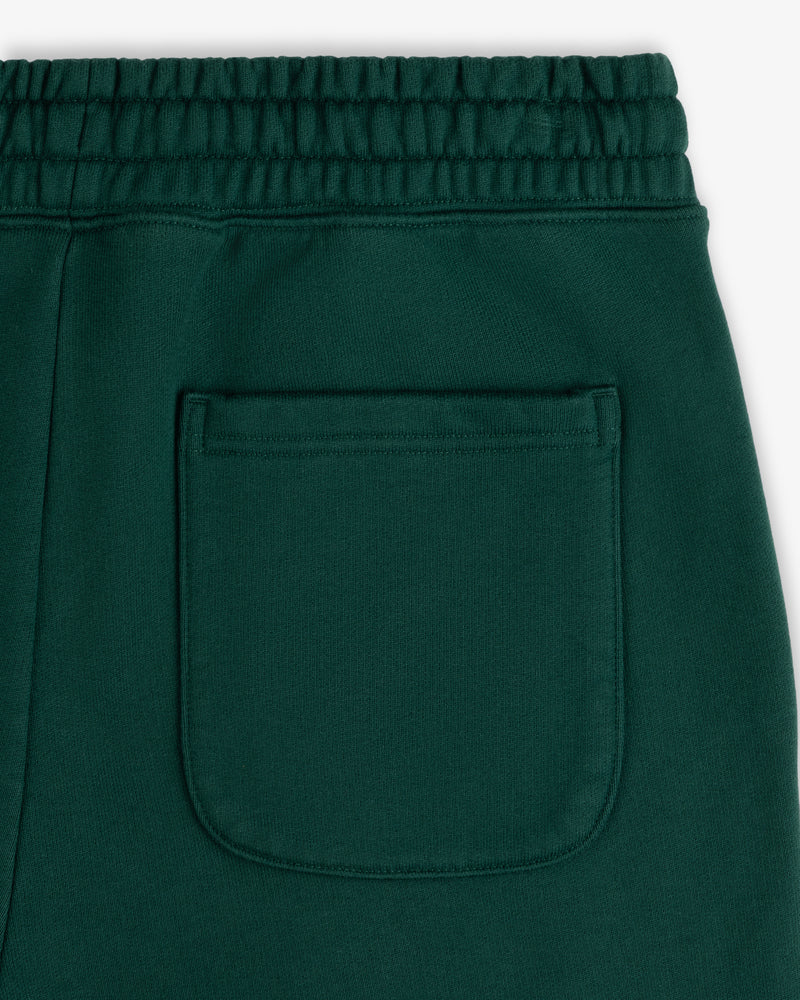 Close-up of Unisphere Sweatpants in green, featuring an elastic waistband and a single back pocket.