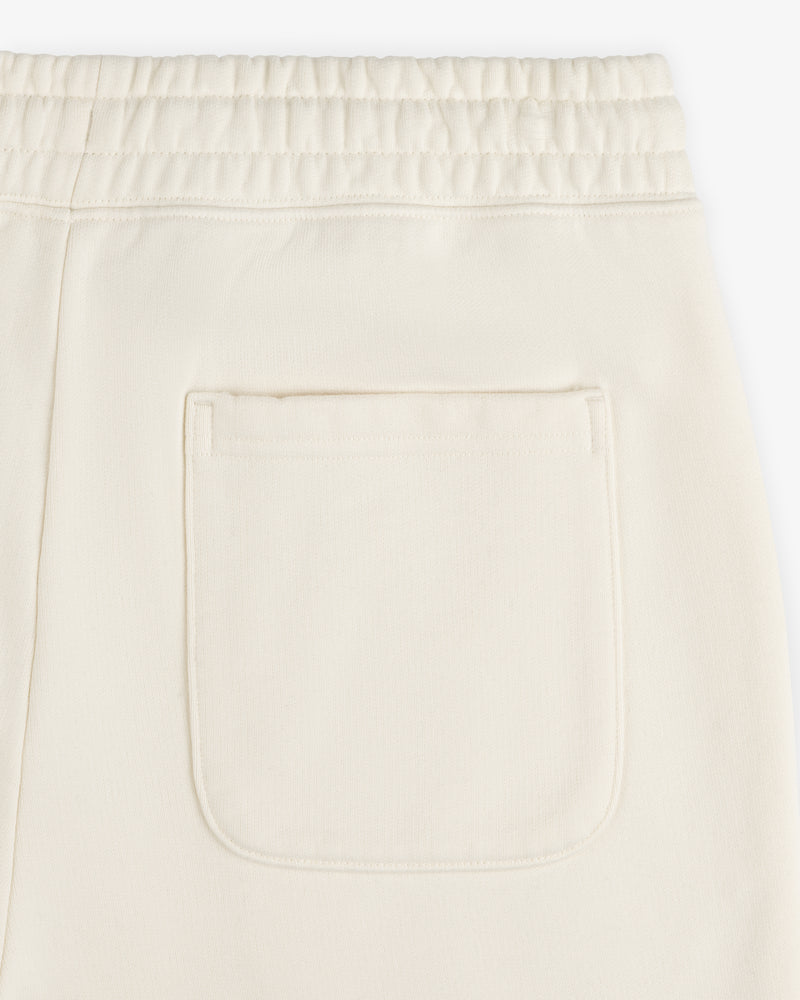 Close-up of Unisphere Sweatpants in cream with an elastic waistband and a single square back pocket.