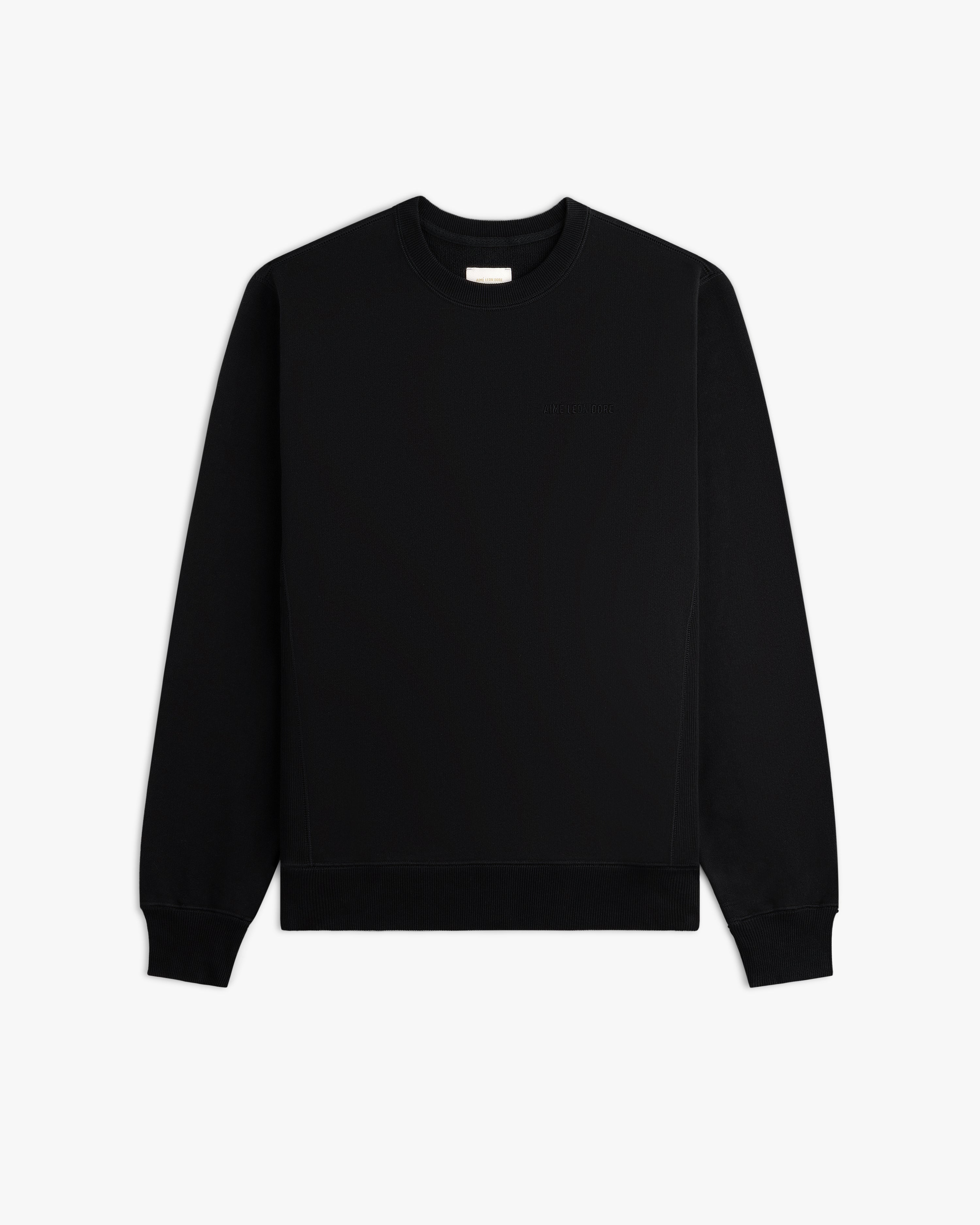 Tonal Logo Crewneck Sweatshirt: black, long sleeves, ribbed cuffs/waistband, shown on a white background.