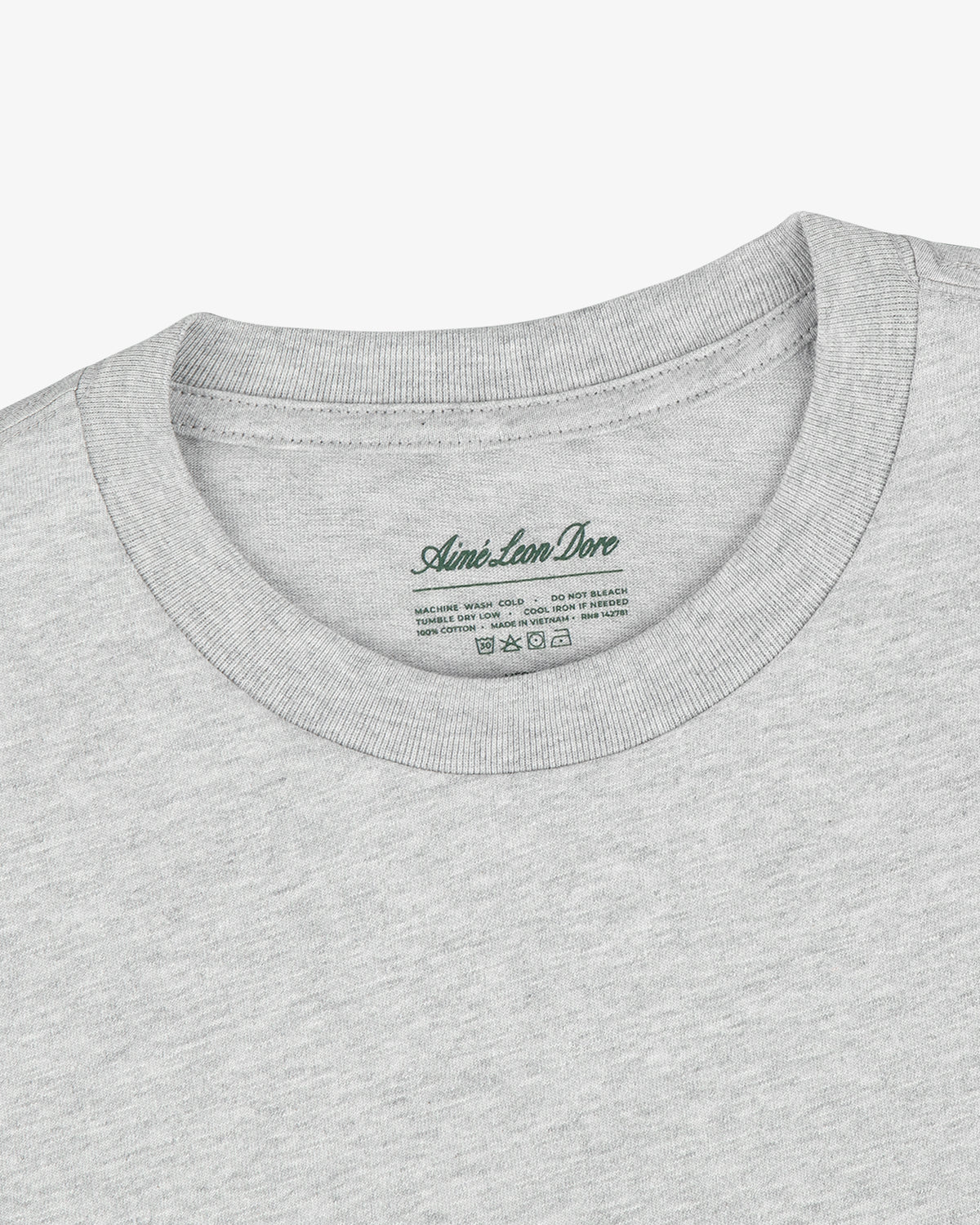 Close-up of a Multi-Color T-Shirt 3-Pack in light gray with Aimé Leon Dore label printed inside the collar.
