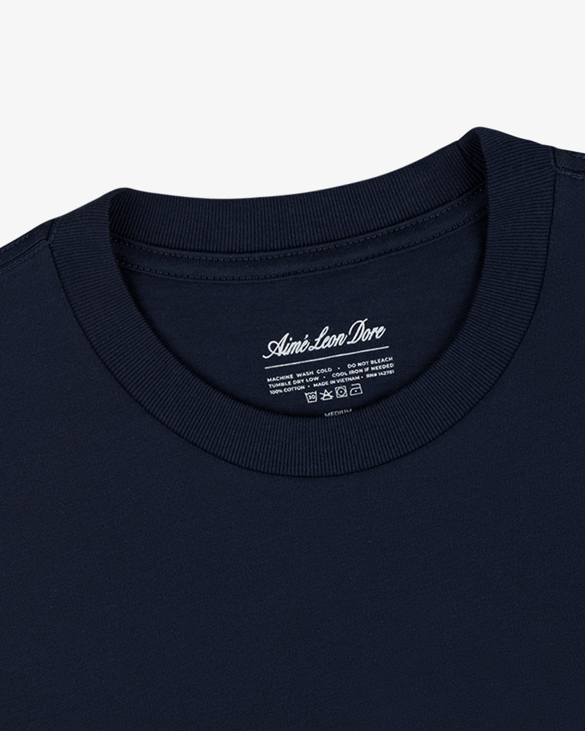 Close-up of a Multi-Color T-Shirt 3-Pack with branding visible on the inside neck label.