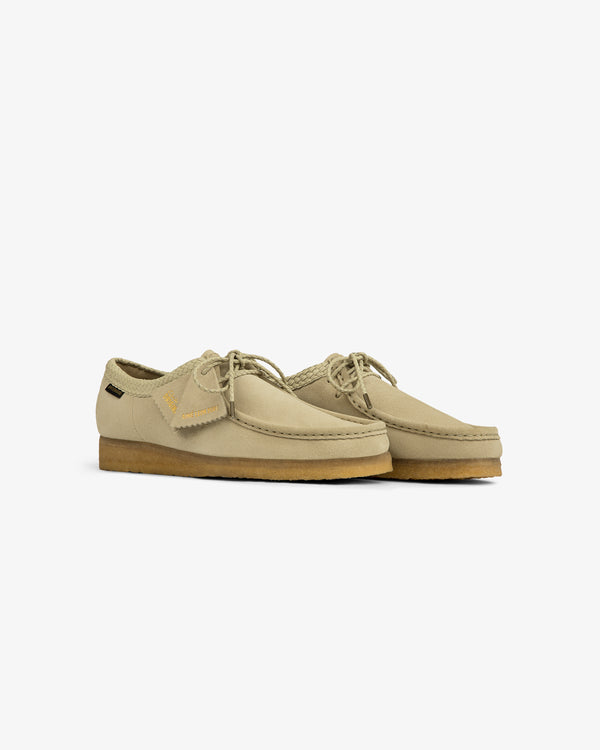 ALD / Clarks Suede Wallabee in beige with crepe soles and laces, shown on a white background.