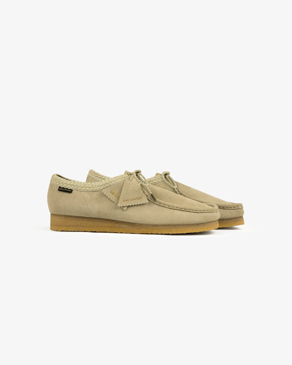 ALD / Clarks Suede Wallabee in beige suede with crepe soles and lace detail, shown on a white background.